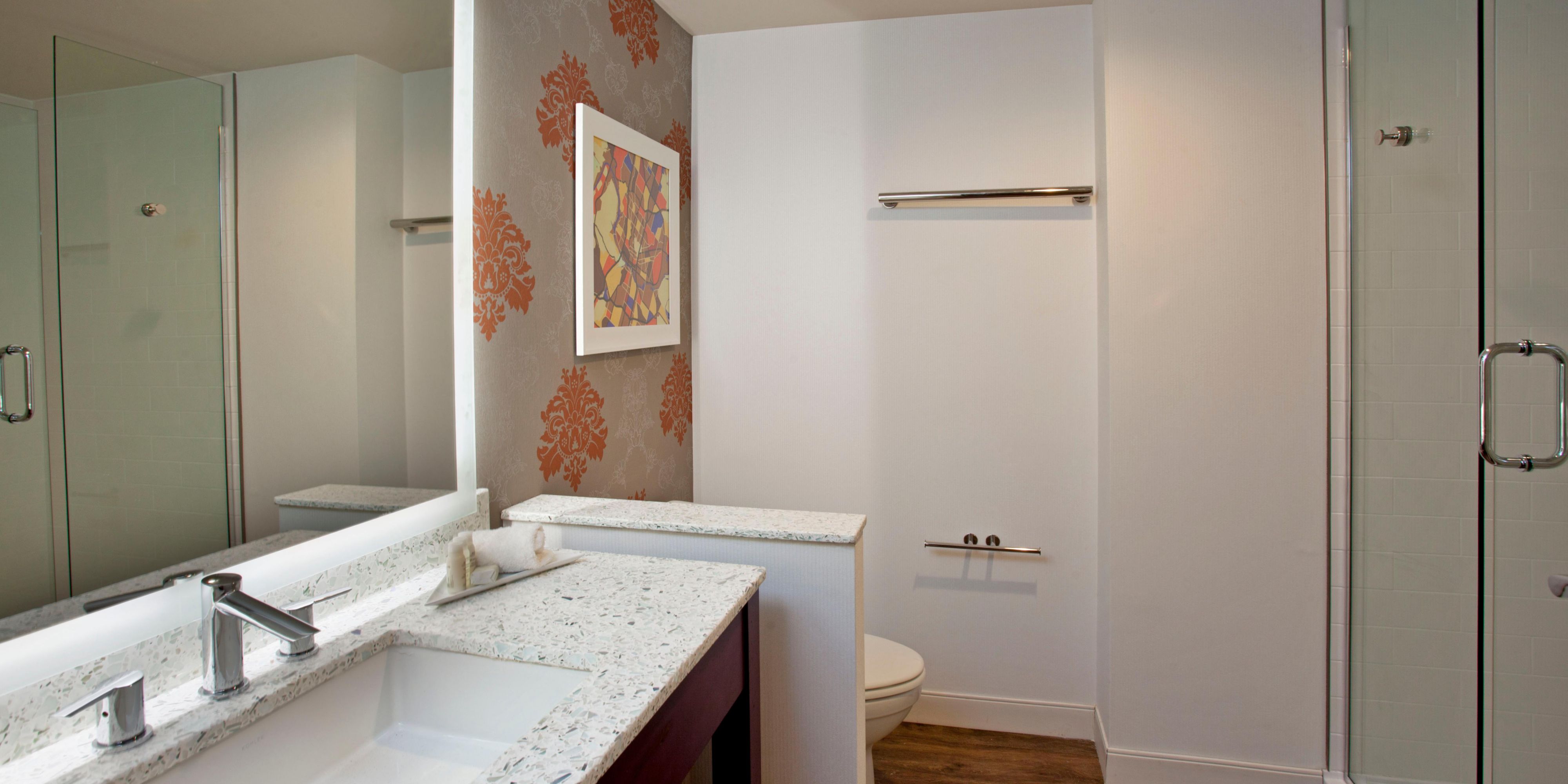 Guest bathroom with walk-in shower and marble countertops