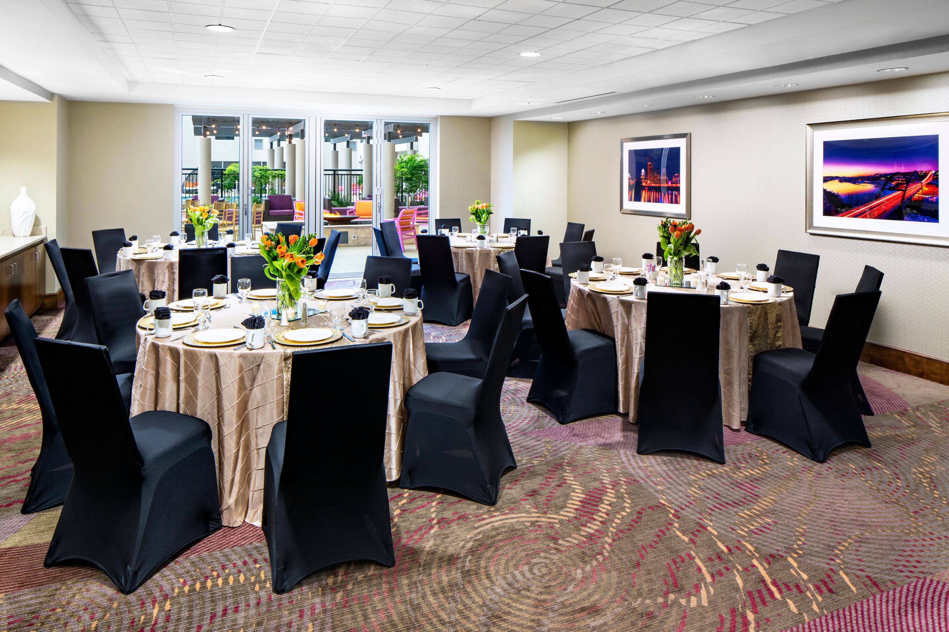 meeting room with banquet tables and french doors