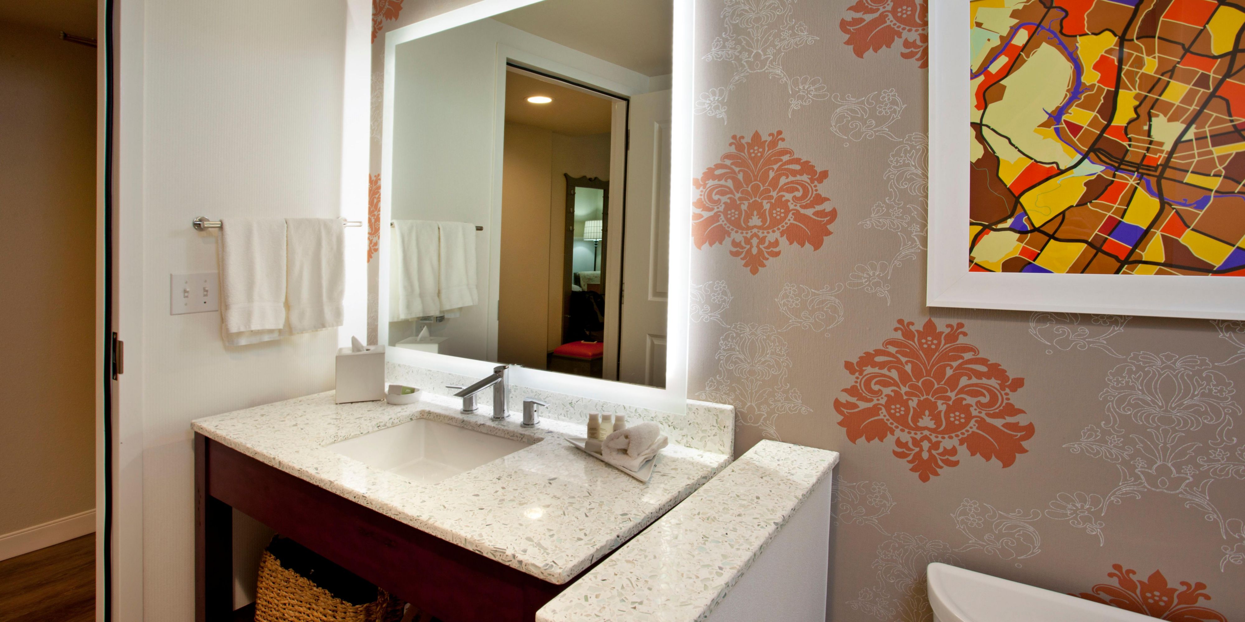 Guest bathroom with generous counter top space and lighting