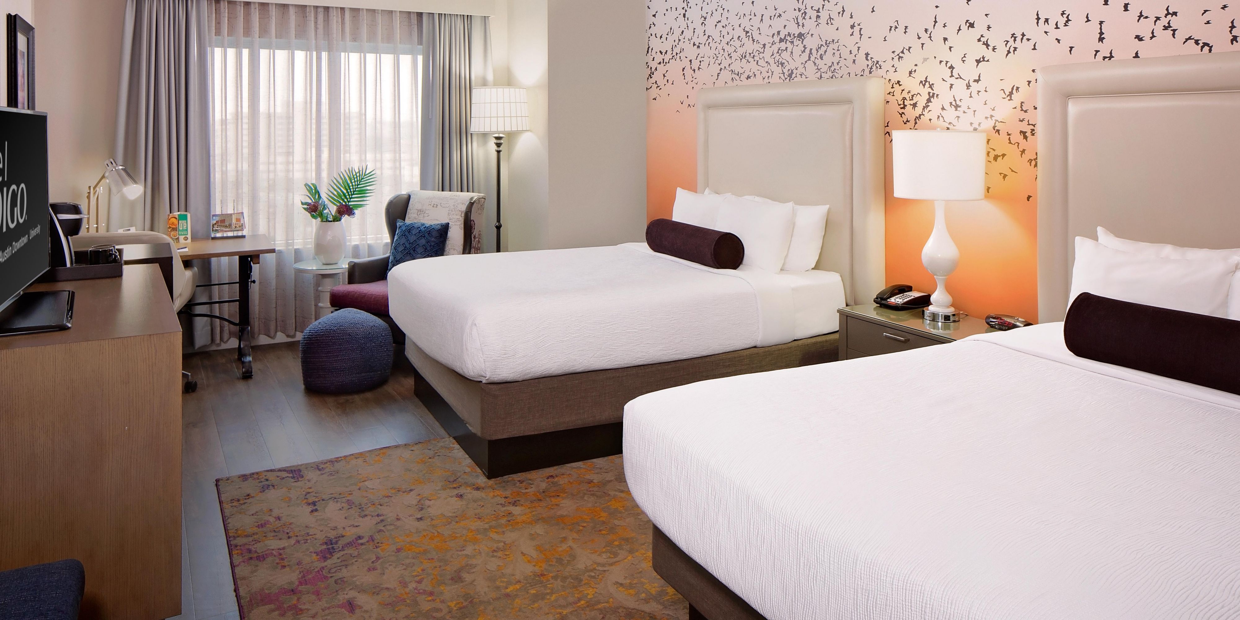 Share the space in our vibrant two-queen downtown Austin room.