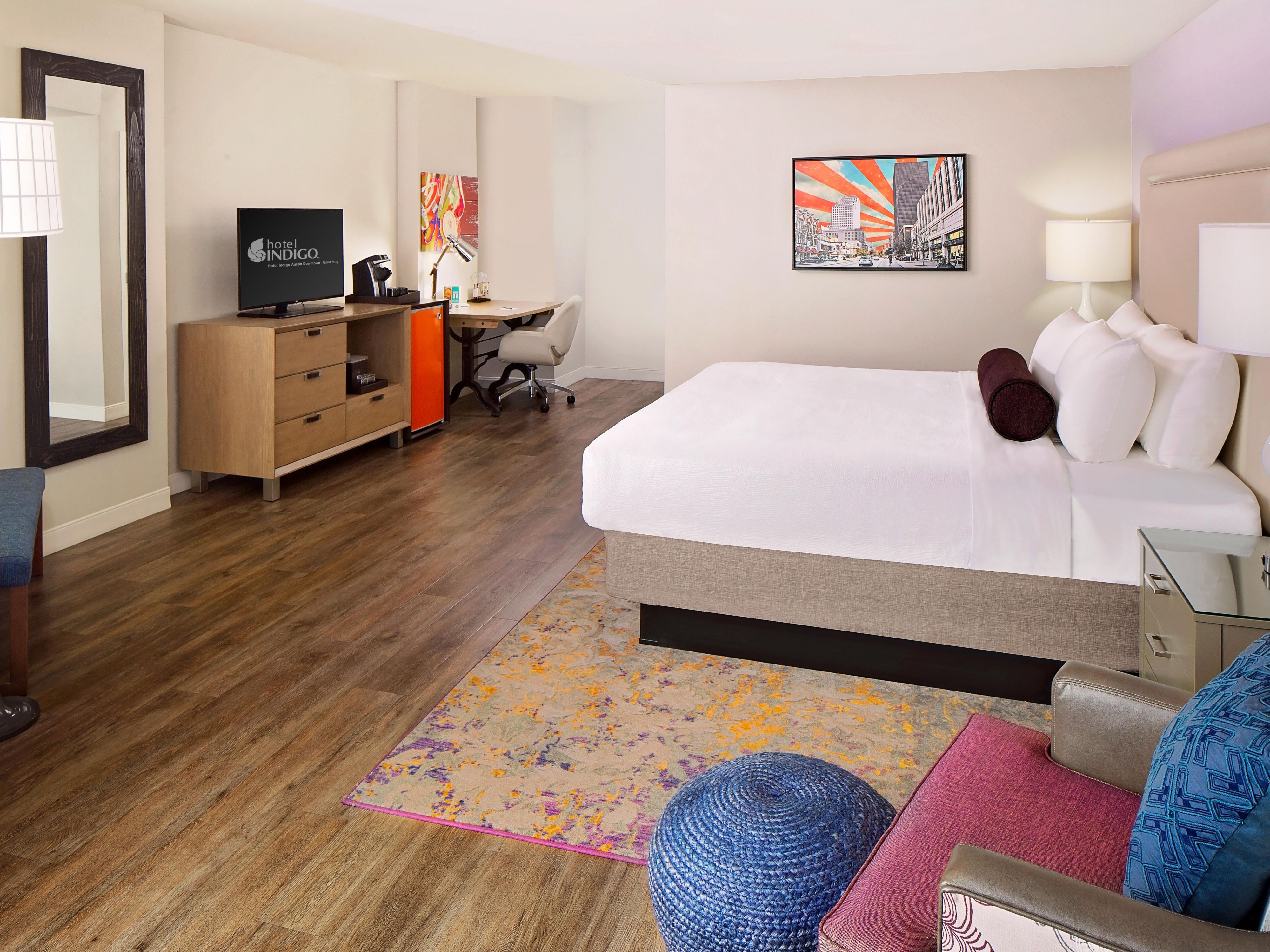 Stretch out in a spacious downtown king room with bold Austin art.