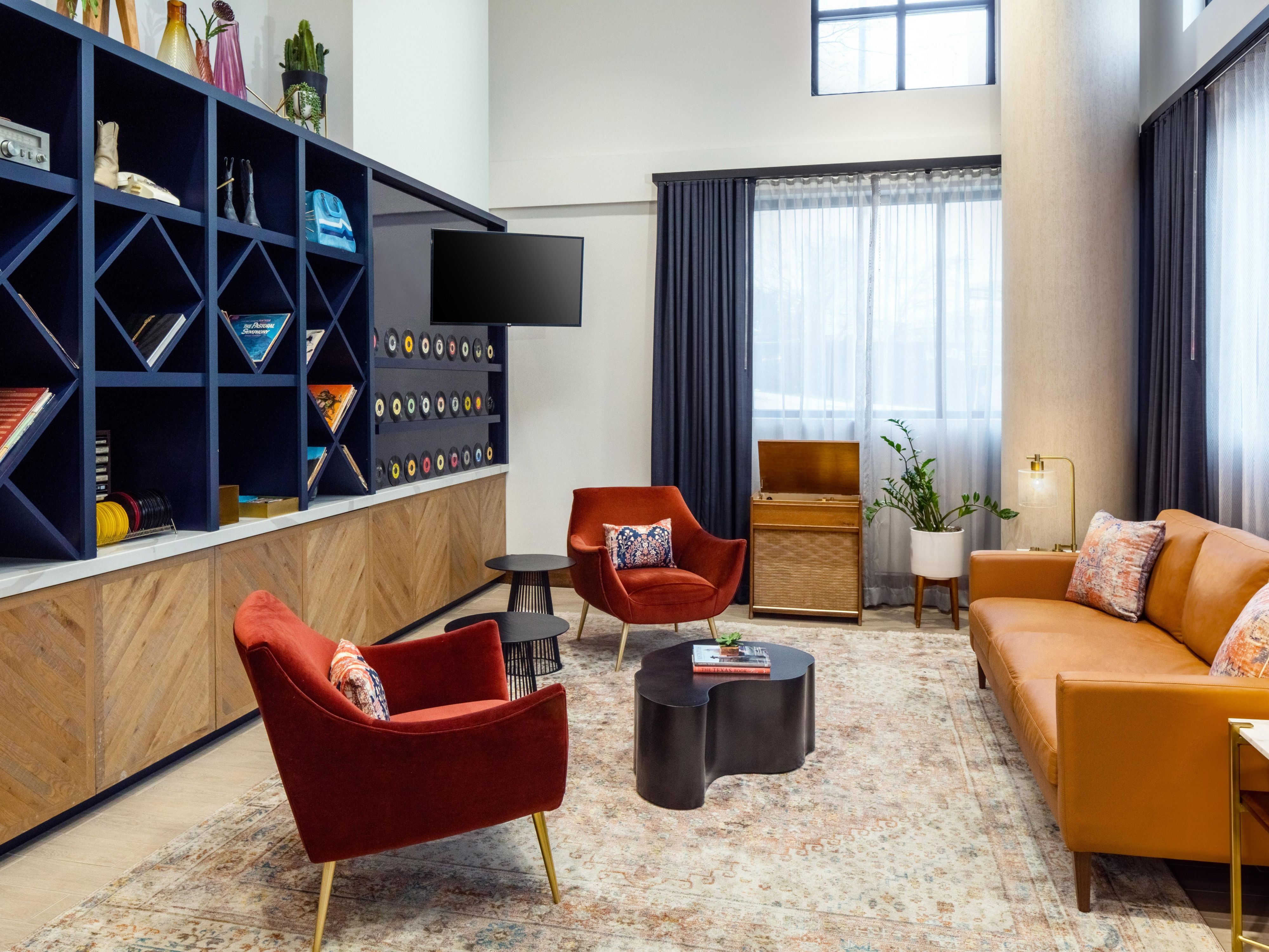 Lounge in our Austin hotel with vinyl and mid-century style.