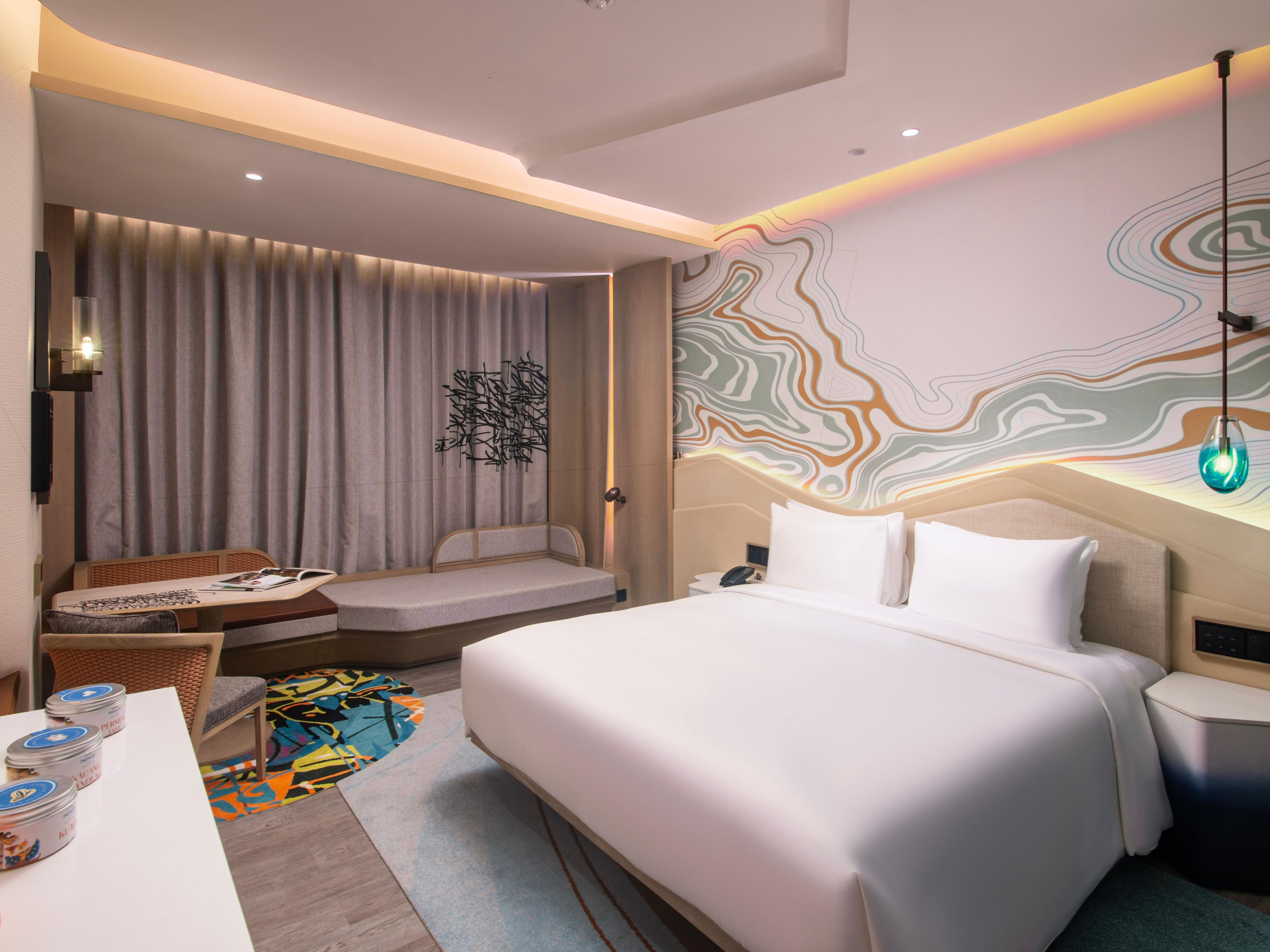 Inspired by the mountain mists surrounding Dago area, our uniquely designed rooms with its soothing colours, are brought to life through touches of nature. Spirited from the waterfall layers of rock, batik motifs and topographic contours, typical of Bandung, you will discover these thoughtful details being incorporated throughout your room.