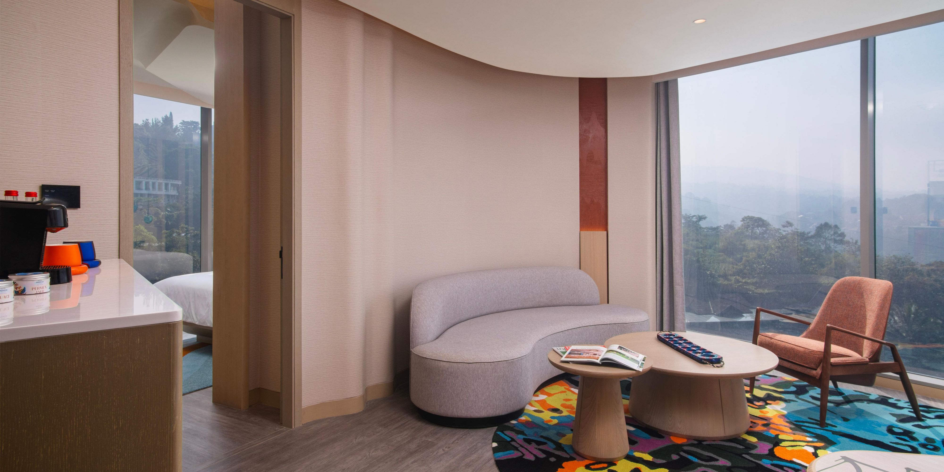 living room corner suitehotel indigo bandung mountain view