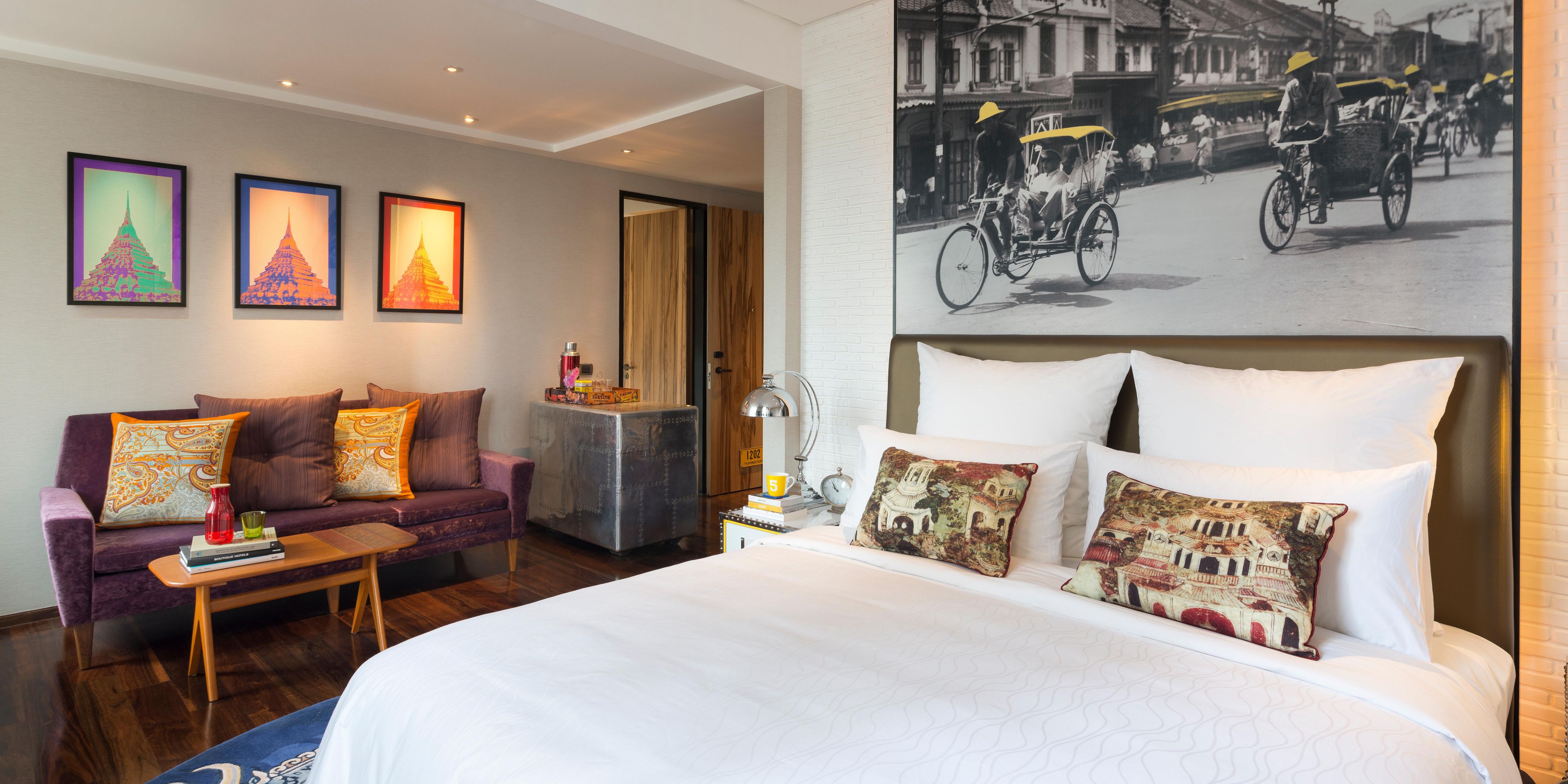 Rooms offer vibrant design, plush bedding and hardwood floors.