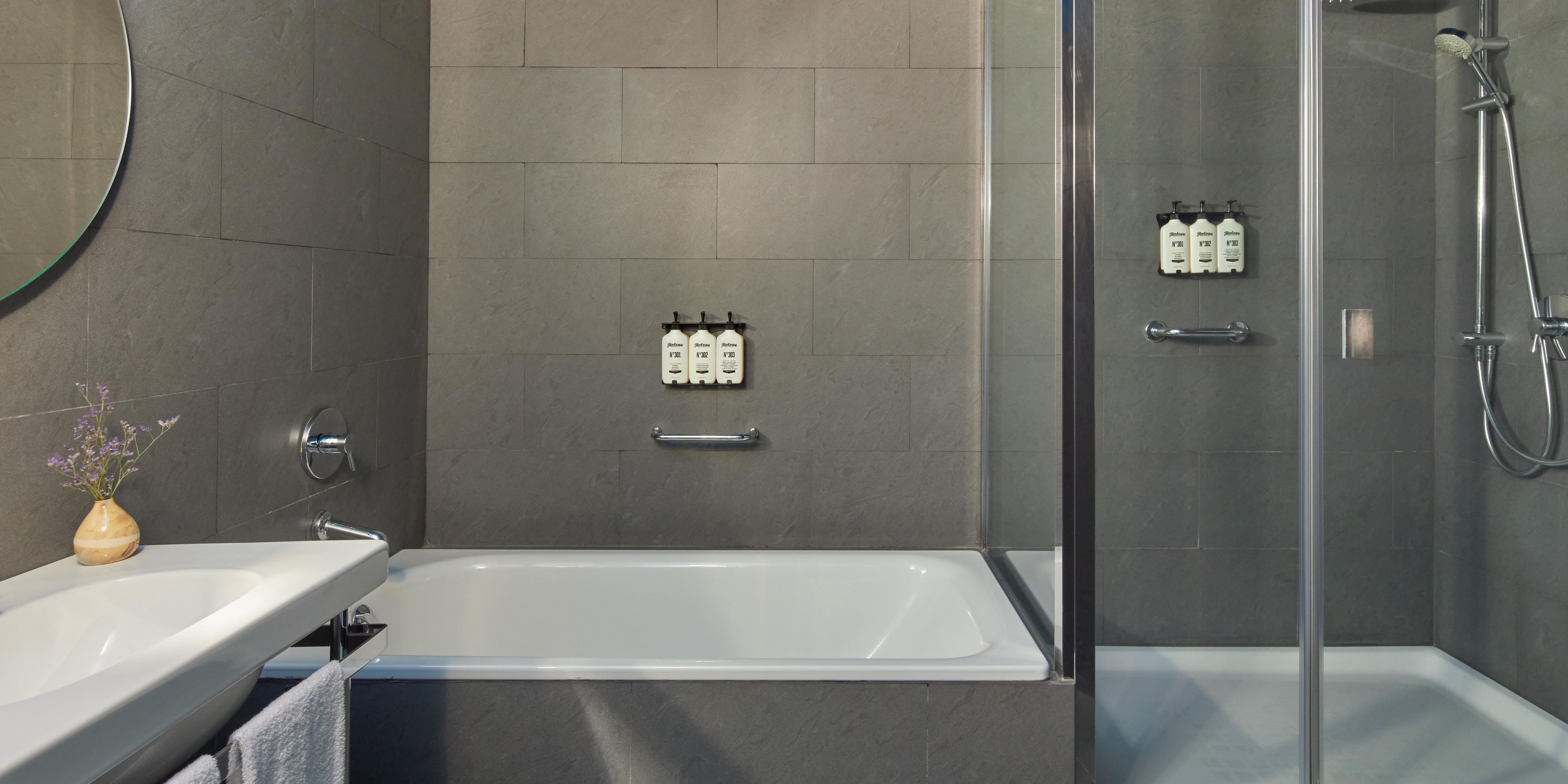 Experience modern luxury in our Barcelona suite bathrooms