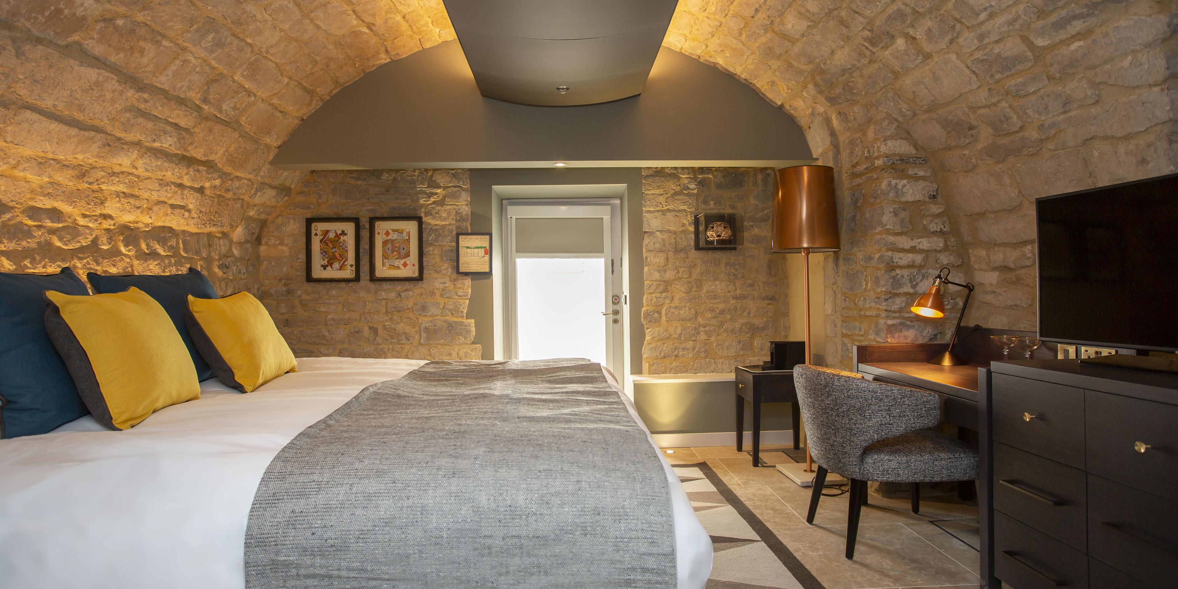 Vaulted Stone Wall Bedroom Interior