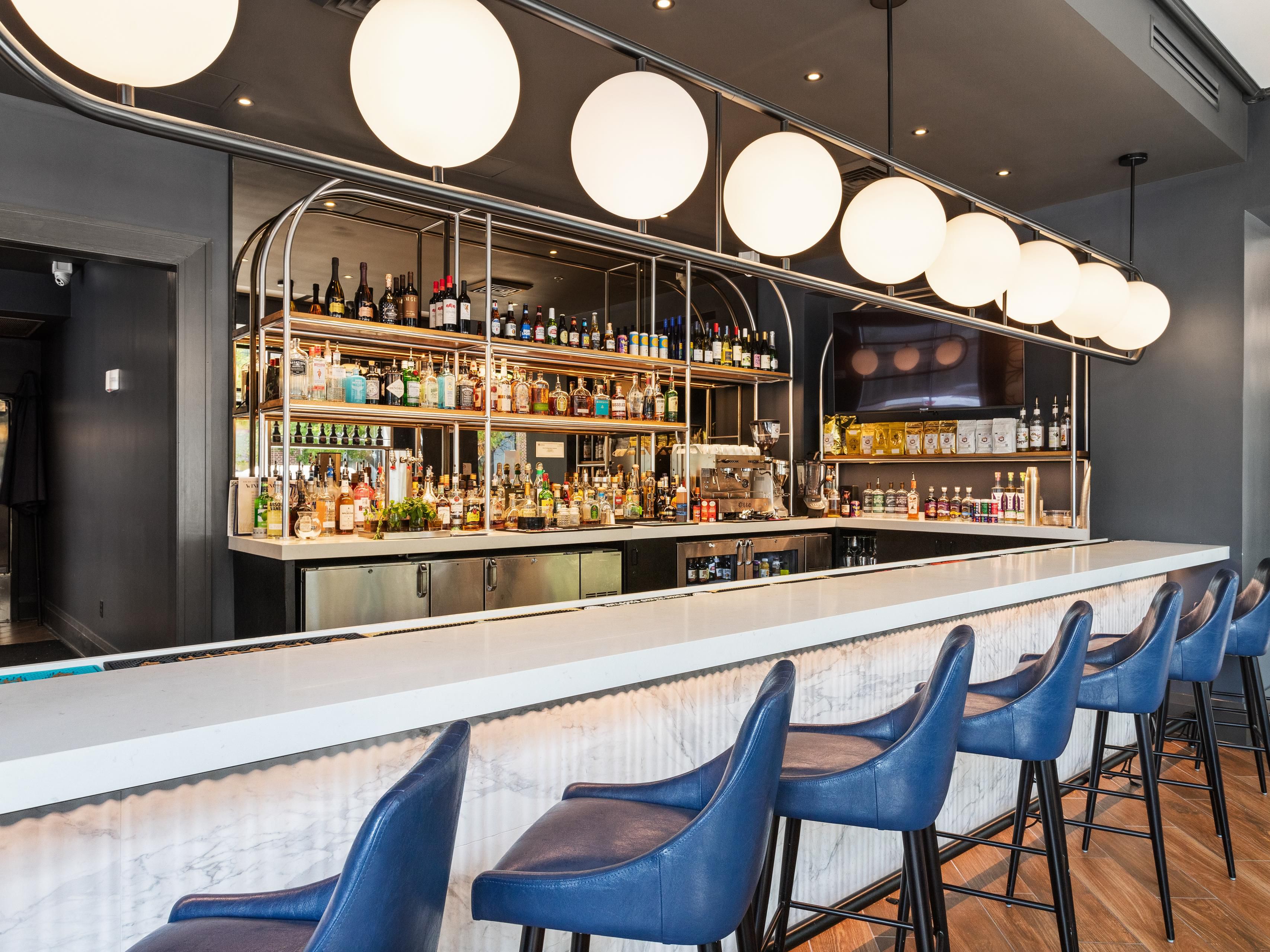 Enjoy a cocktail at the on-site bar while between plans.