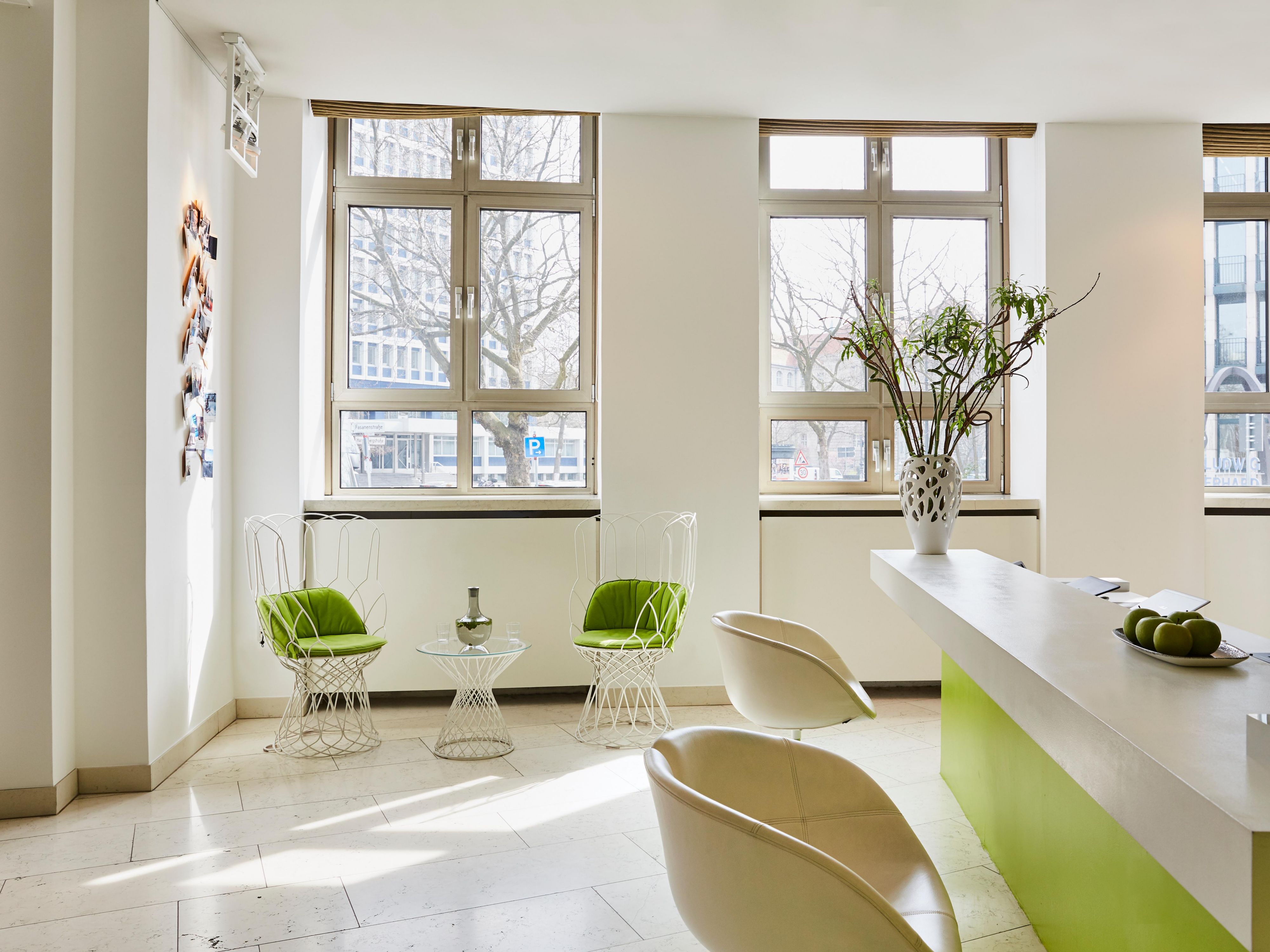 The light-filled Hotel Indigo lobby with crafted designer seating.