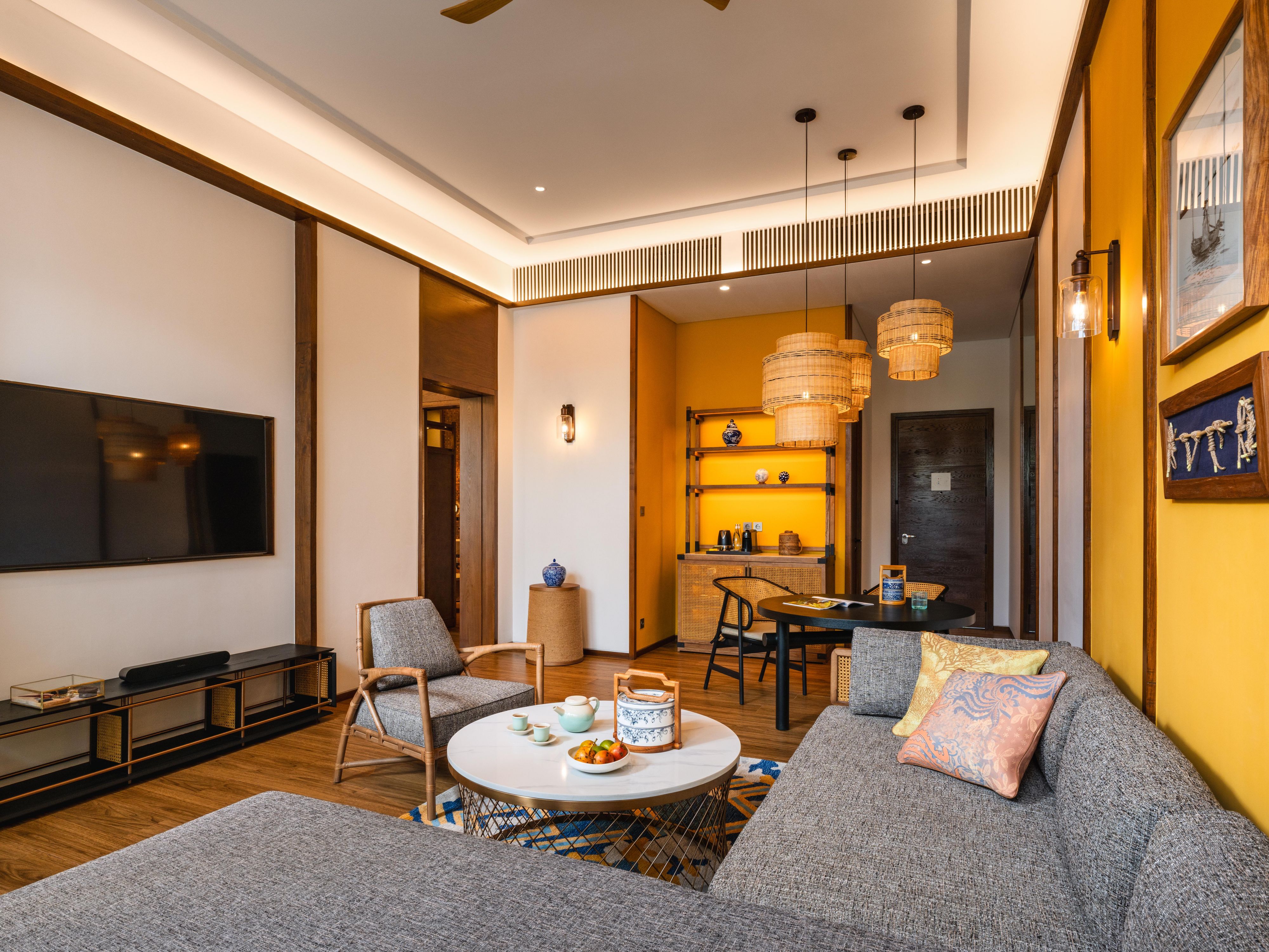 One bedroom suite dining and living area with folklore charm