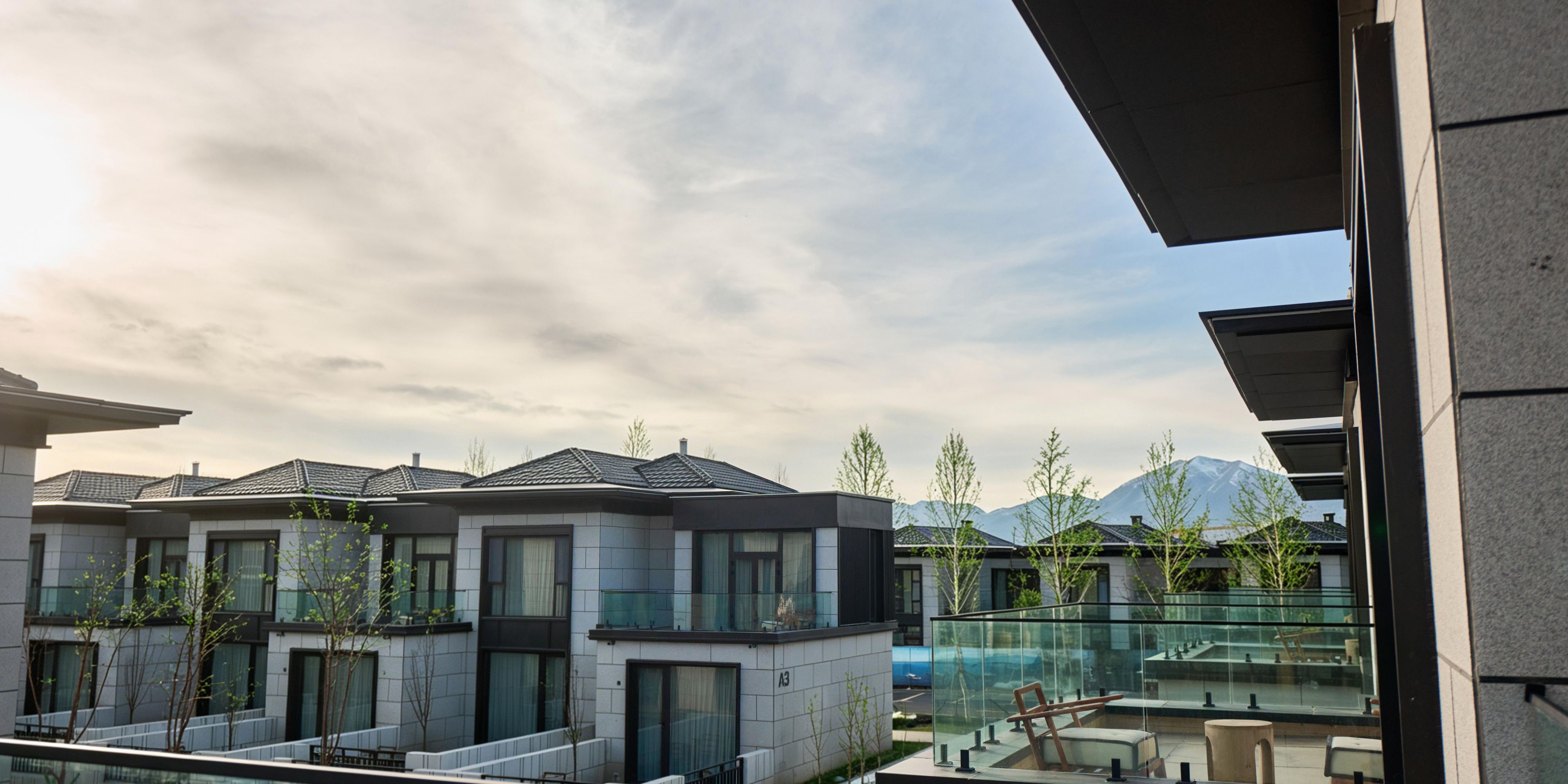 Private suite terrace with garden and distant mountain views