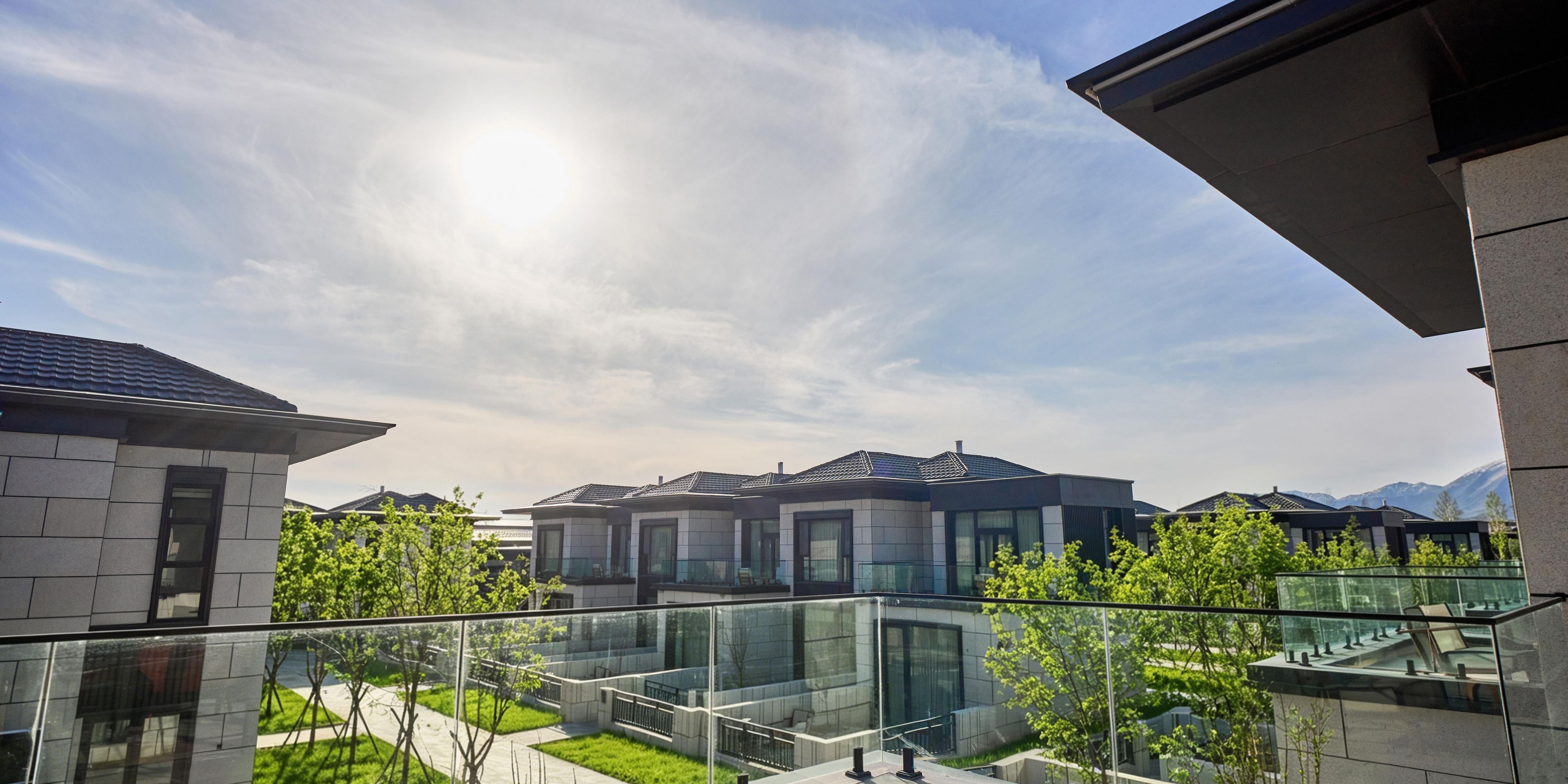 Private suite terrace with garden and distant mountain views