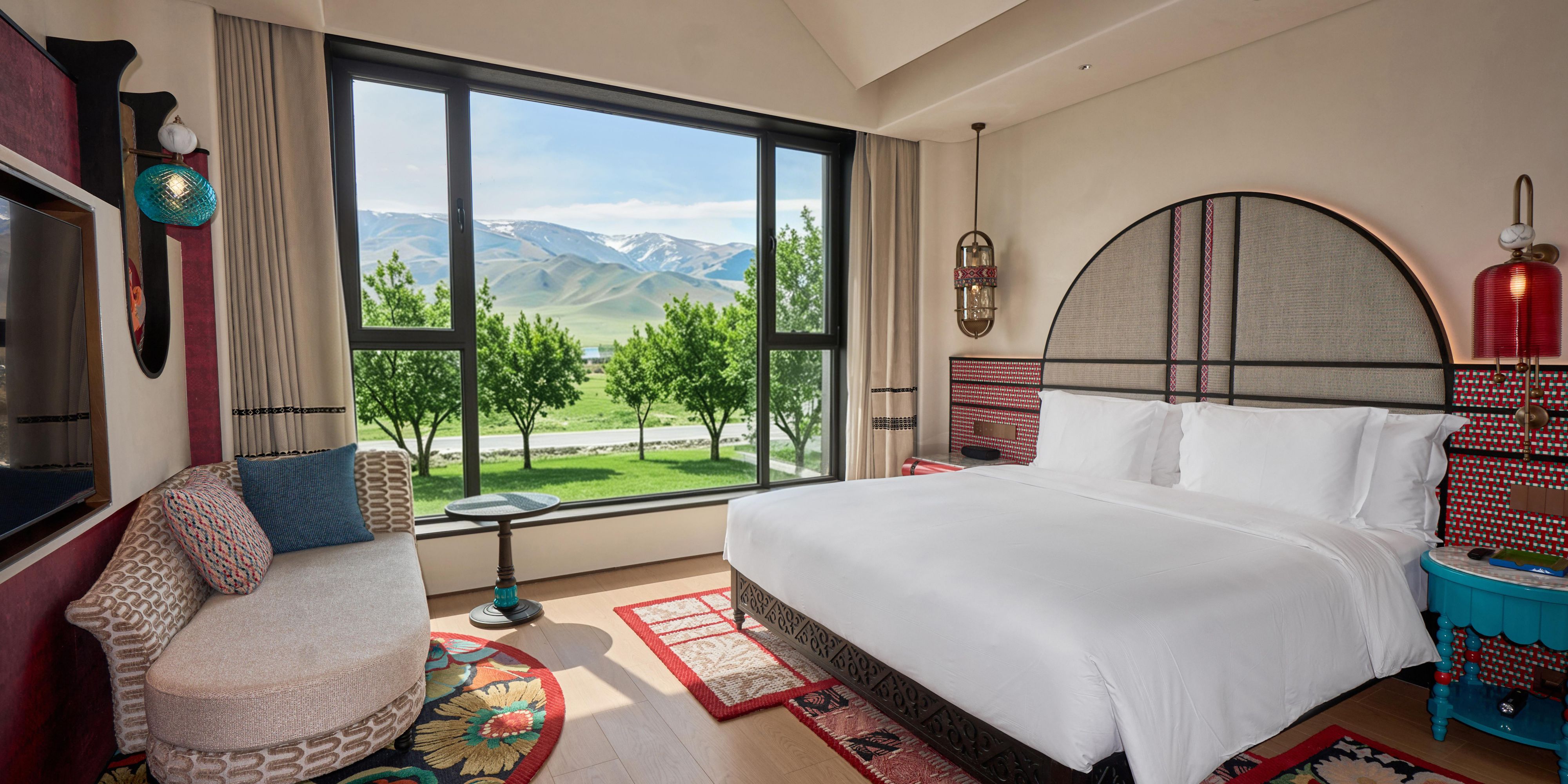 Mountain views through floor-to-ceiling windows, courtyard access