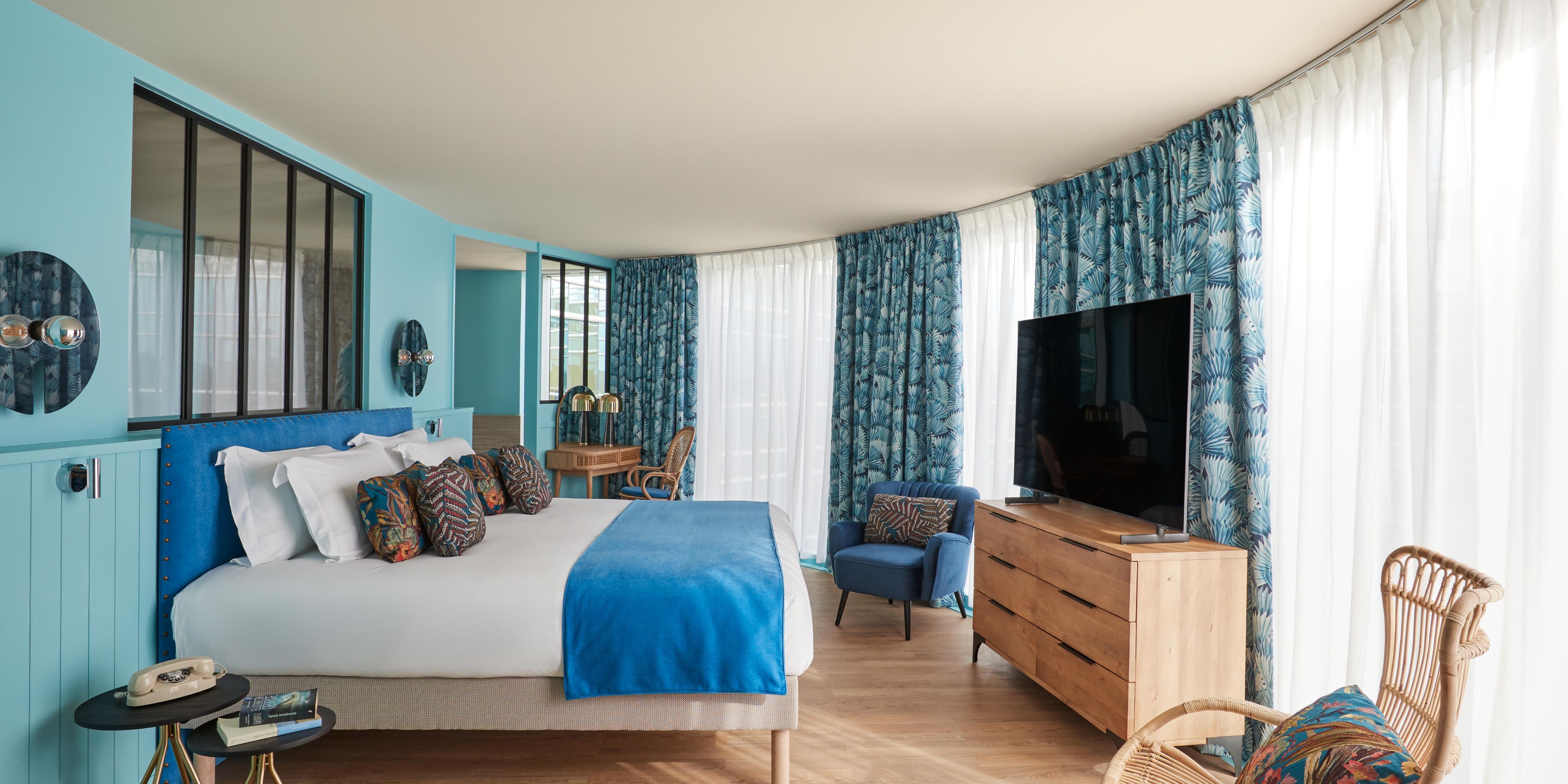 Unwind in vibrant rooms with panoramic city views