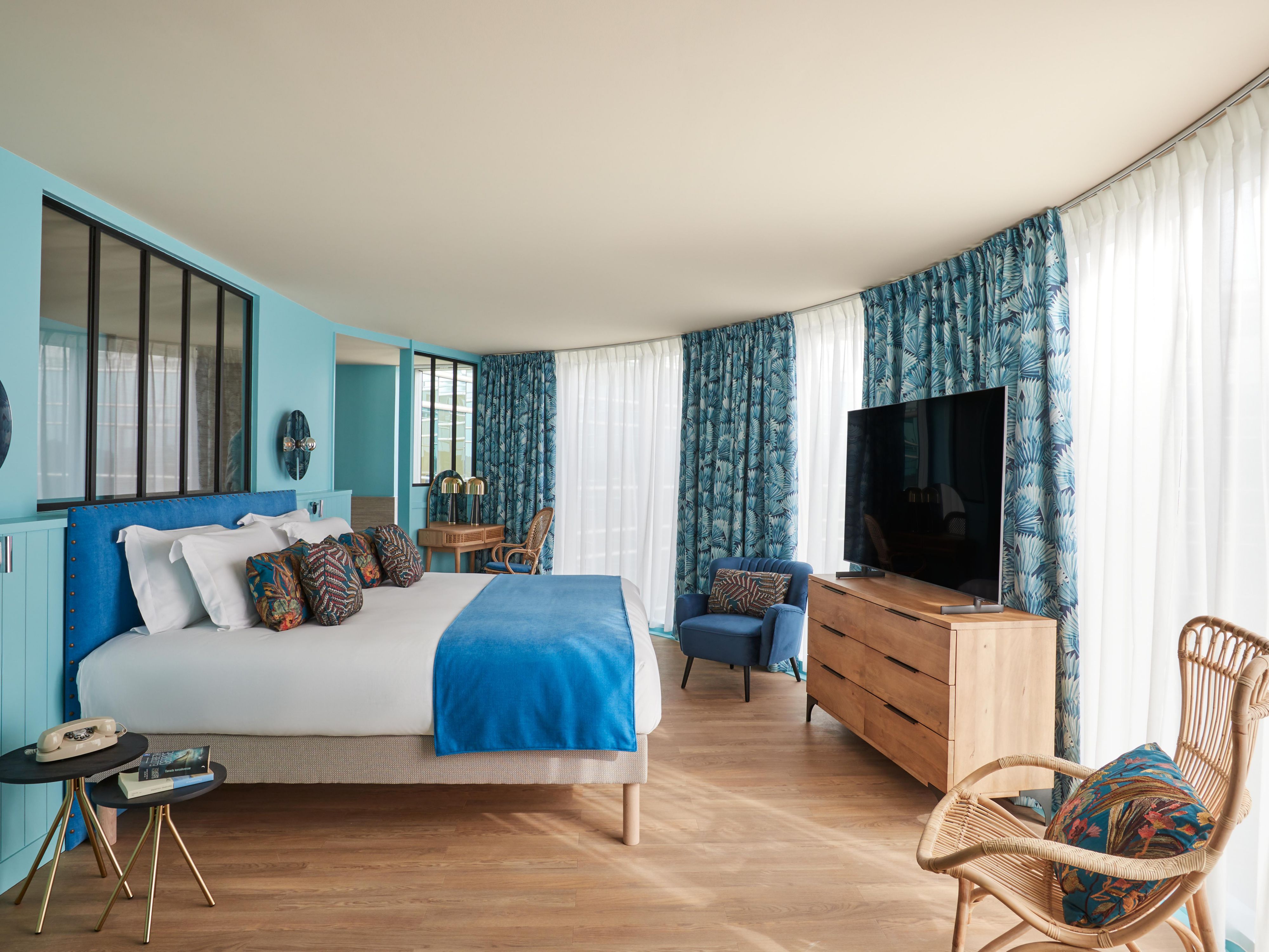 Unwind in vibrant rooms with panoramic city views