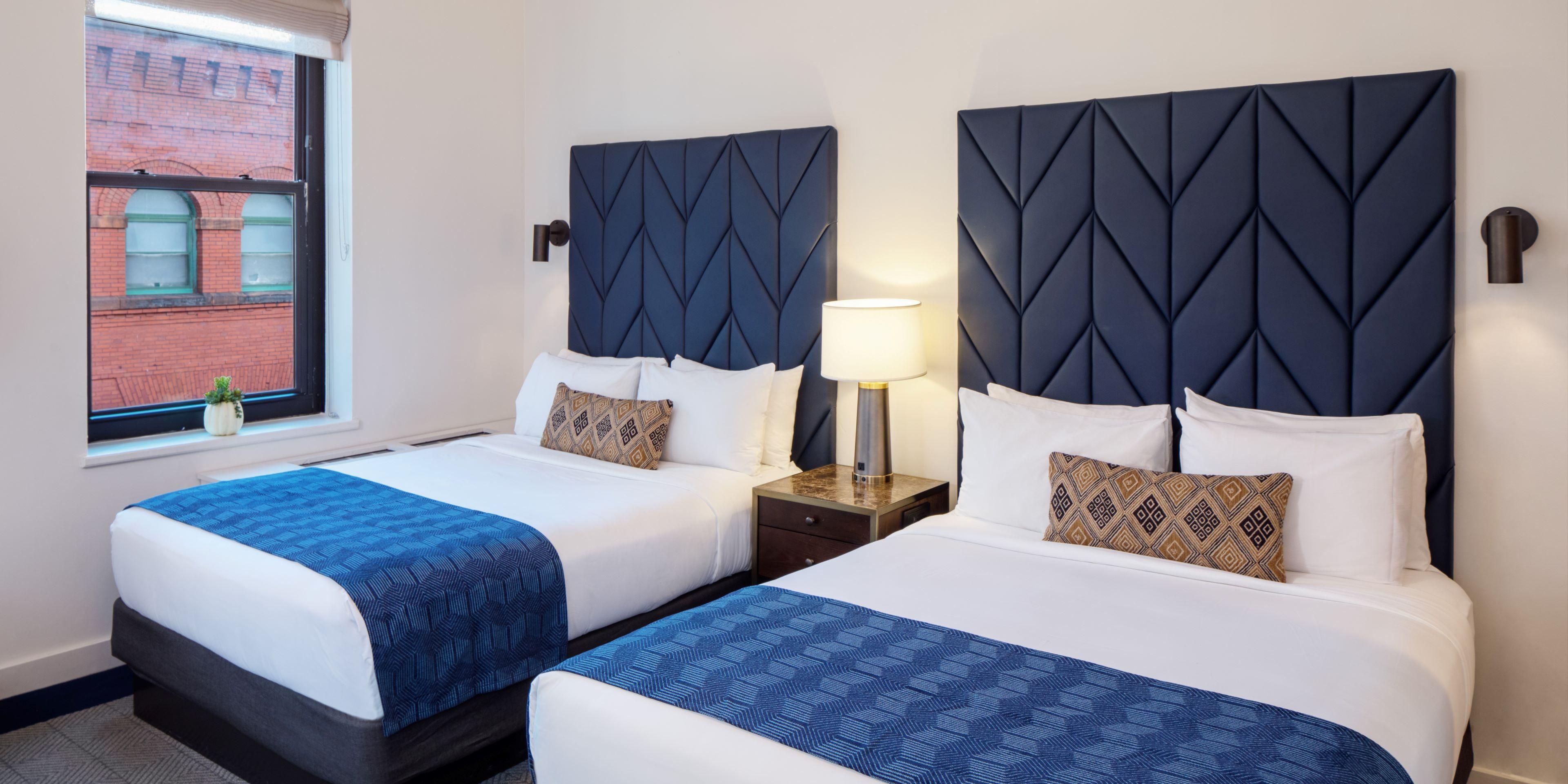 Enjoy our two queen bed guestroom with modern amenities.