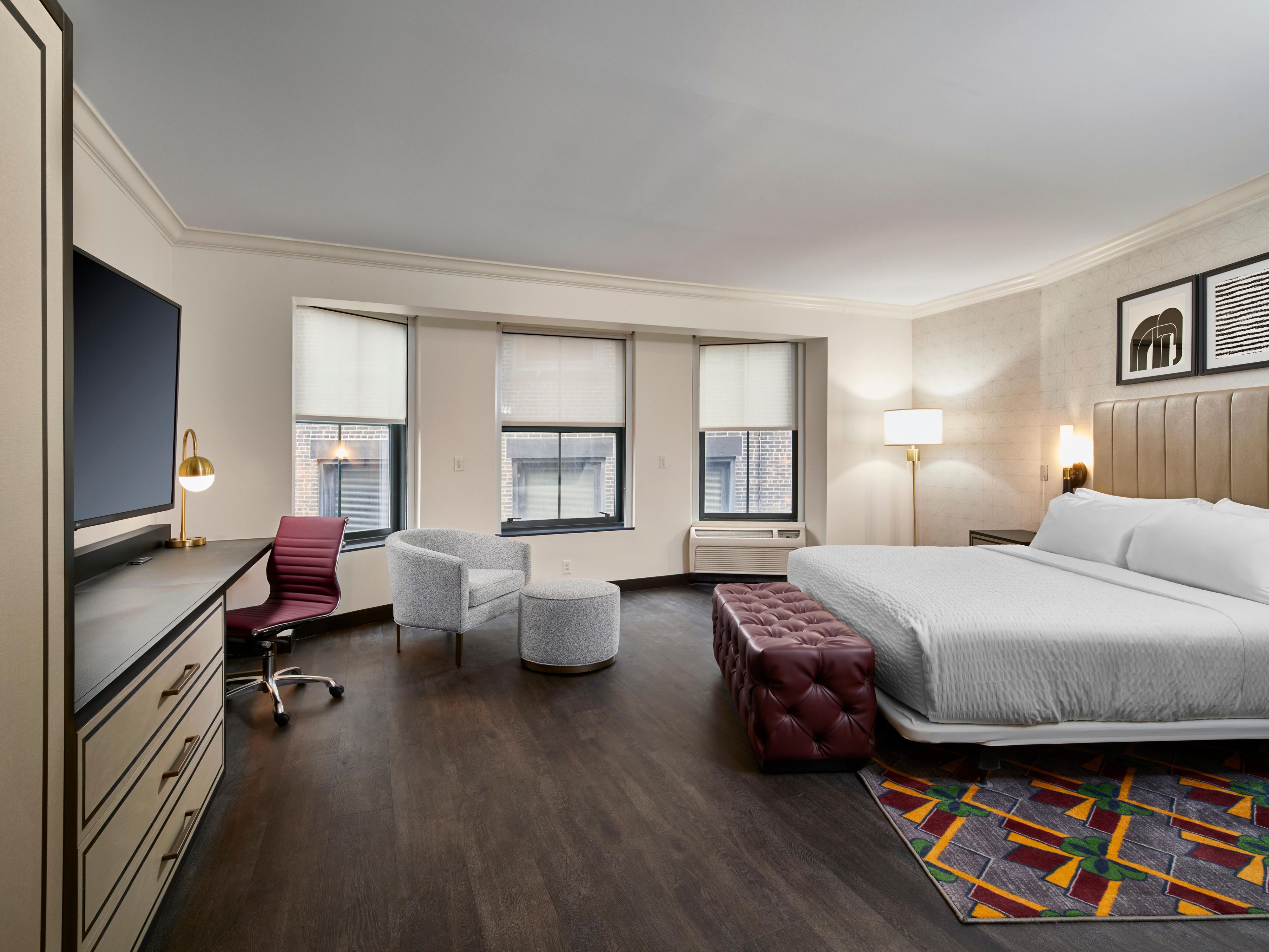 Spacious King accessible guest room featuring hard wood floors 