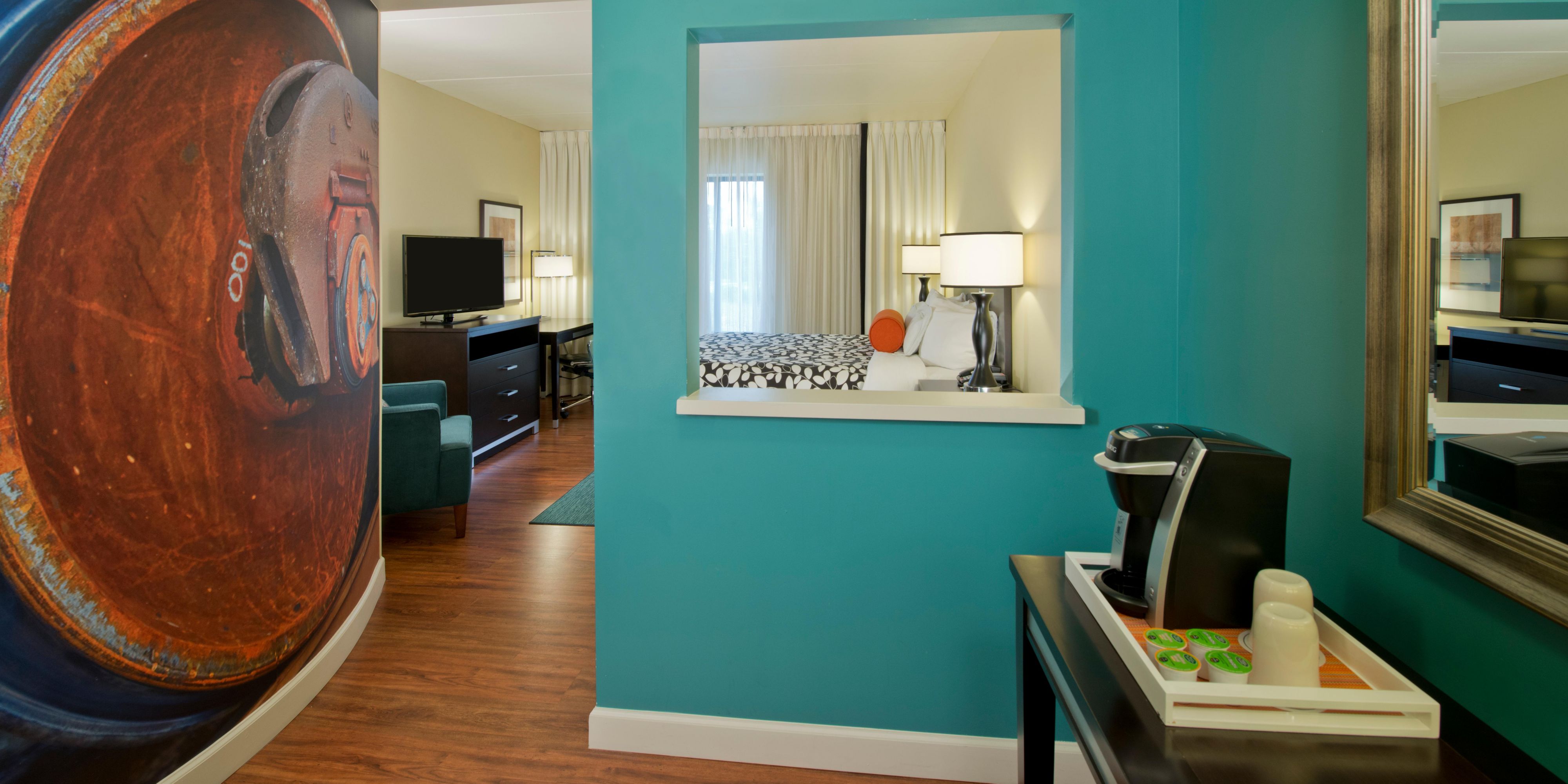 Local murals are just one of the simple pleasures in each room.