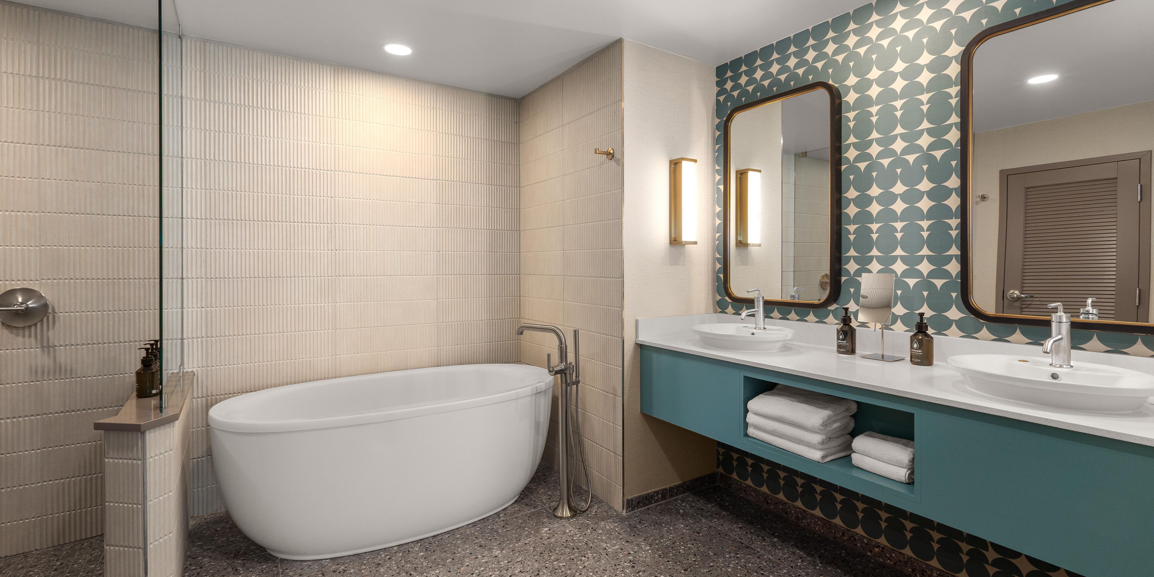 Soak in our free-standing tub or share vast space on 2 sinks 