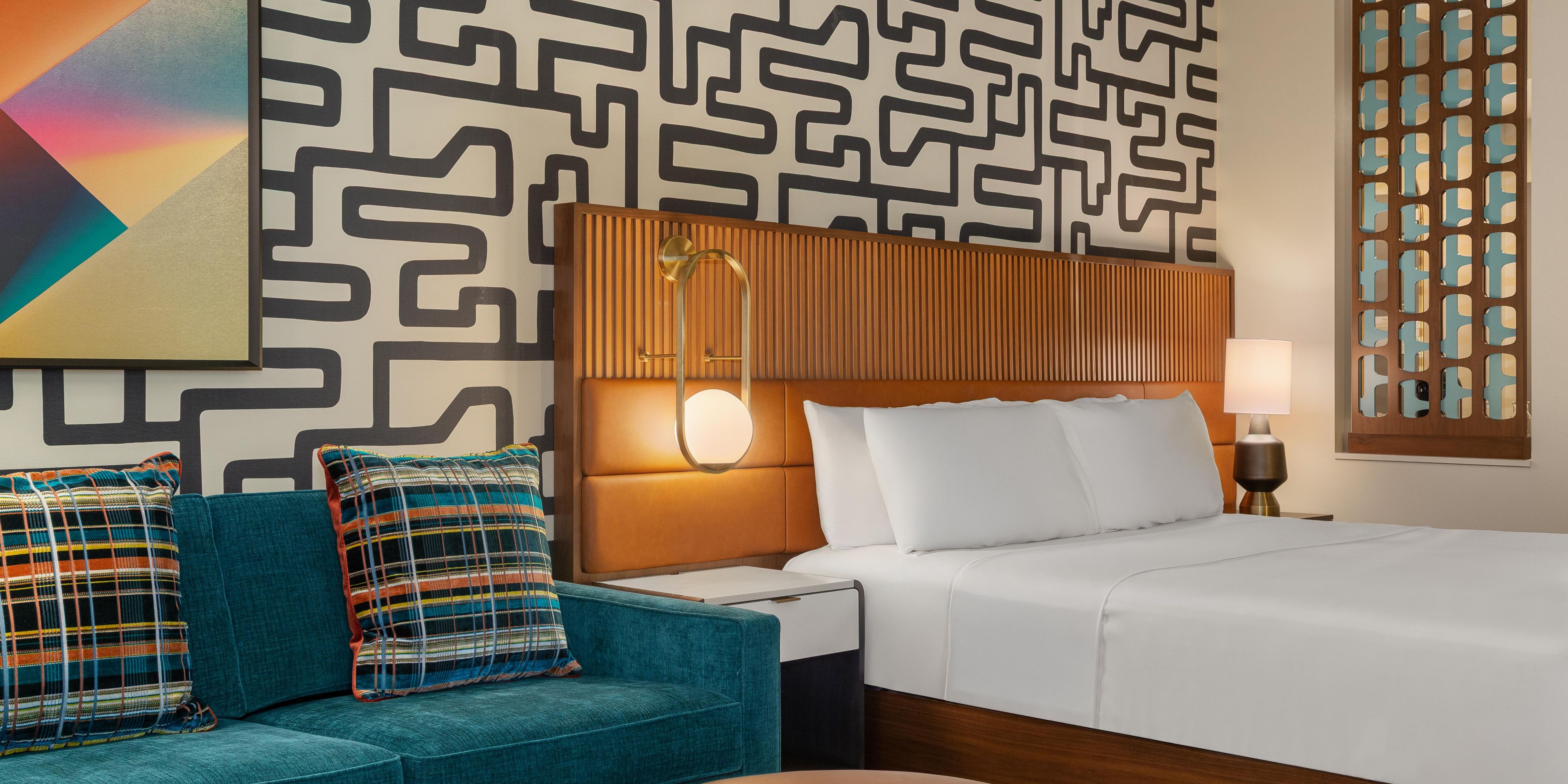 Bold patterns, soft bedding and cozy seating to elevate every stay