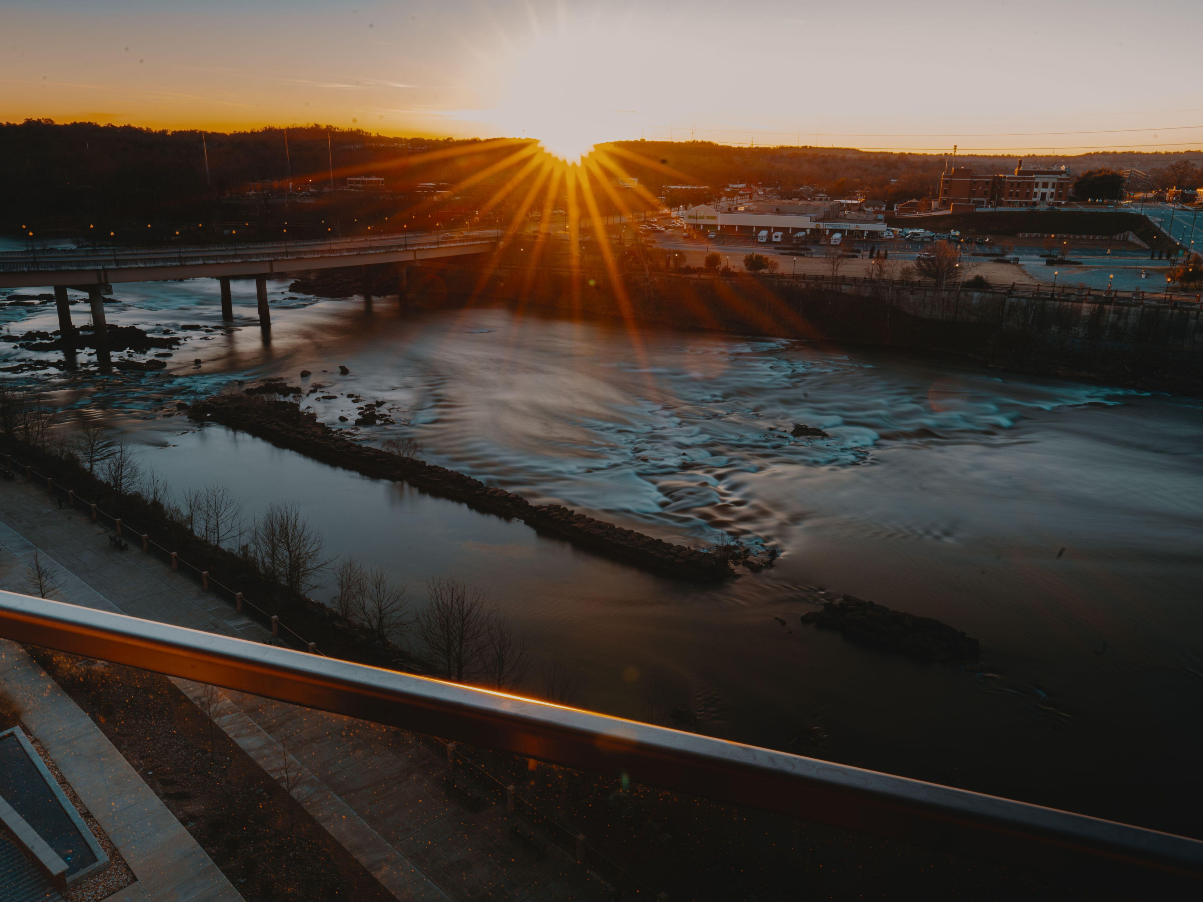 Take in a beautiful sunset from Eighteen85 Rooftop Bar + Kitchen!
