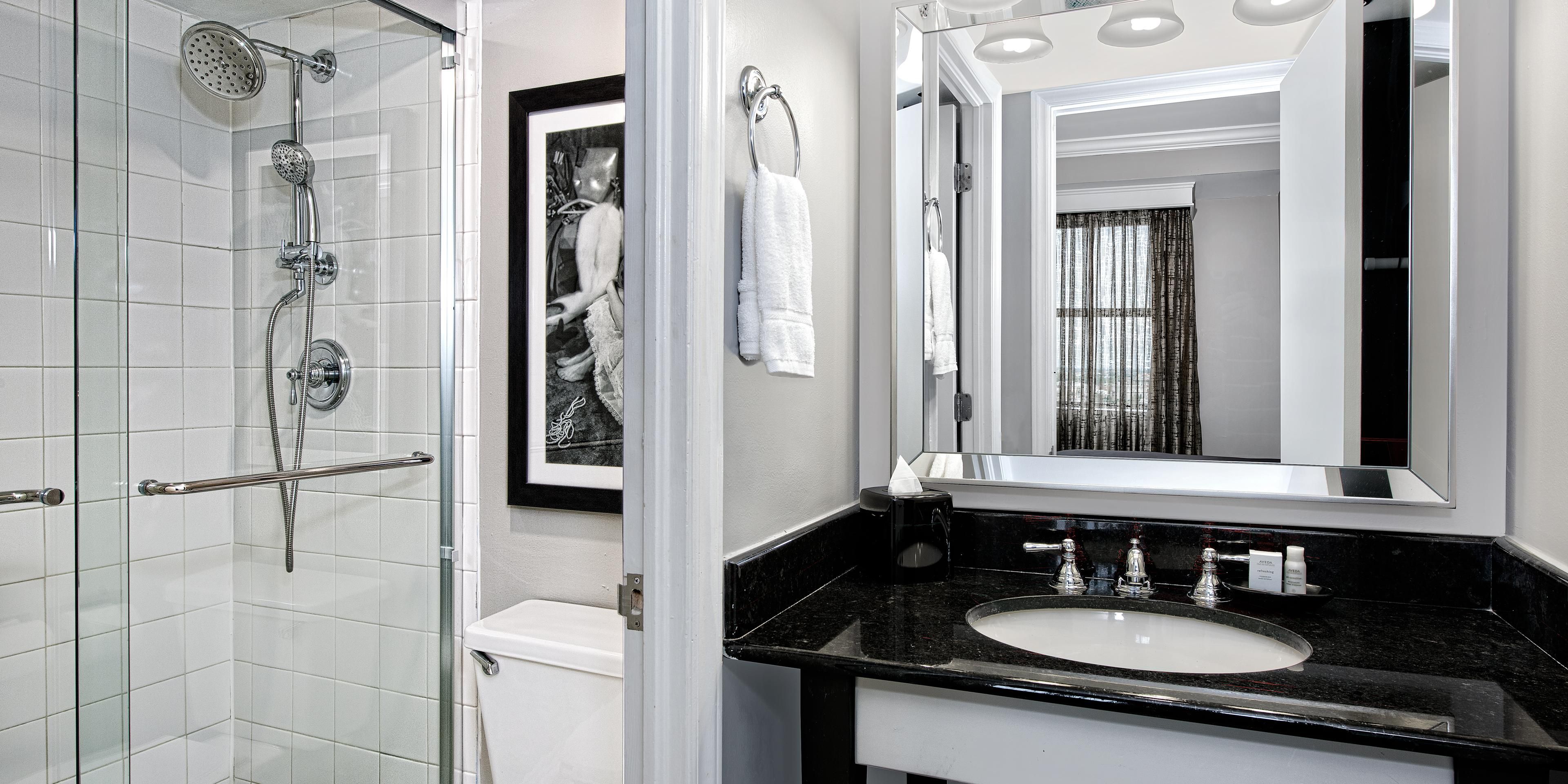 Spacious guest bathrooms with ample counter space.