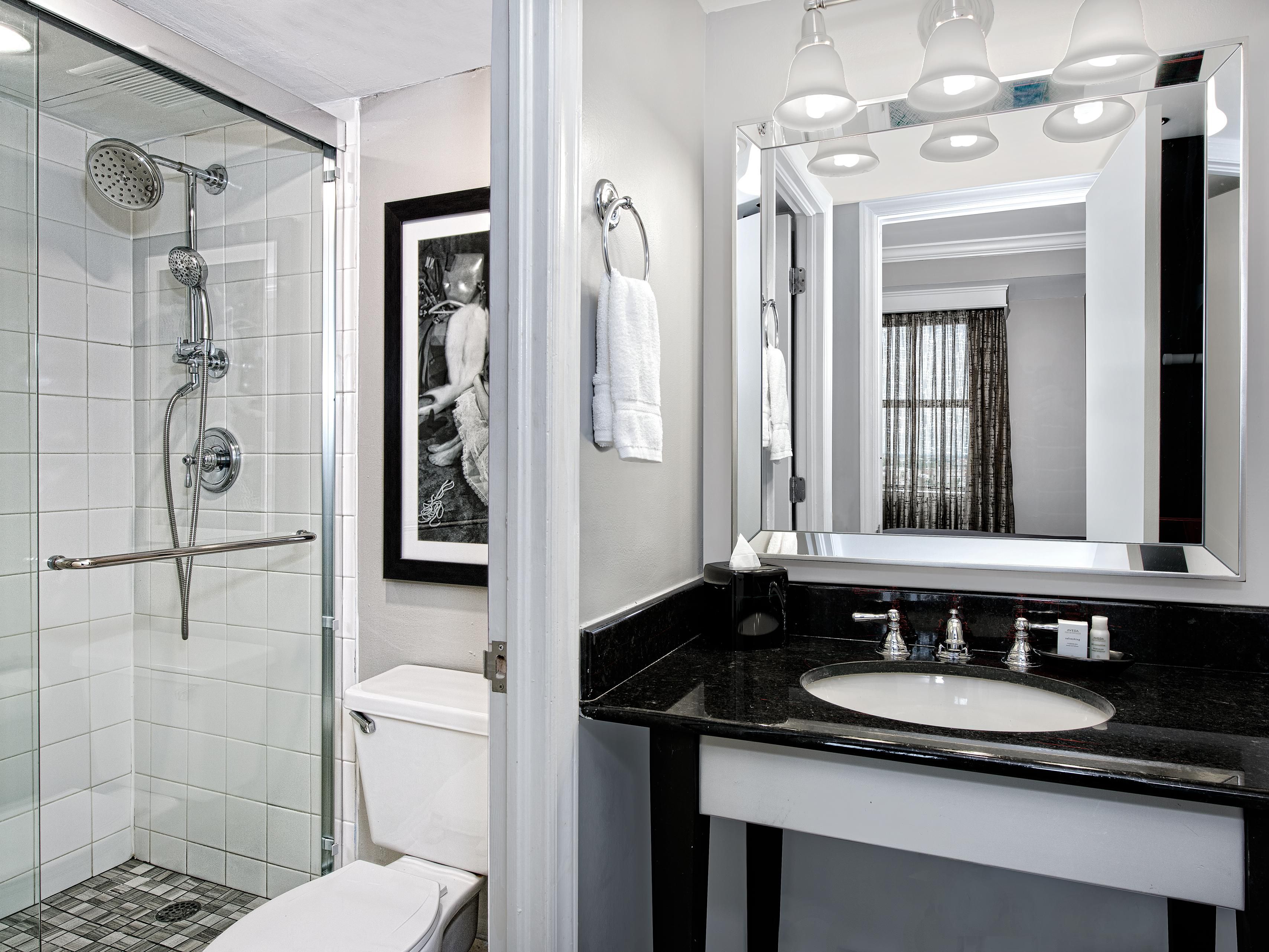 Spacious guest bathrooms with ample counter space.
