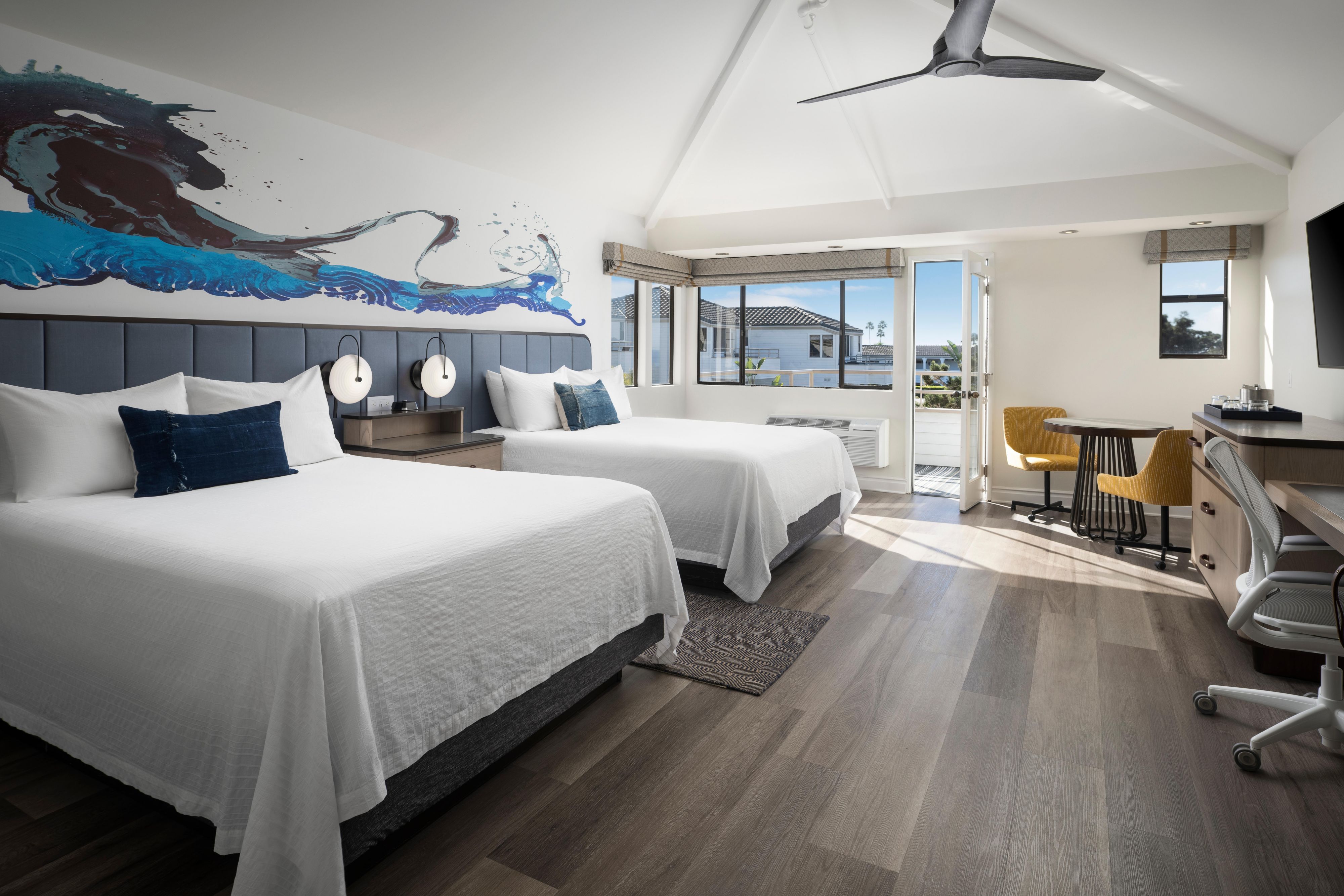 All of the 94 newly renovated rooms and suites, many of which are accompanied by a private or semi-private balcony and ocean or pool views, offer guests a retreat to relax and recharge. Enjoy contemporary design accented with coastal charm, vibrant murals, plush bedding, flexible work space and spa-like bath amenities on your next Del Mar escape. 