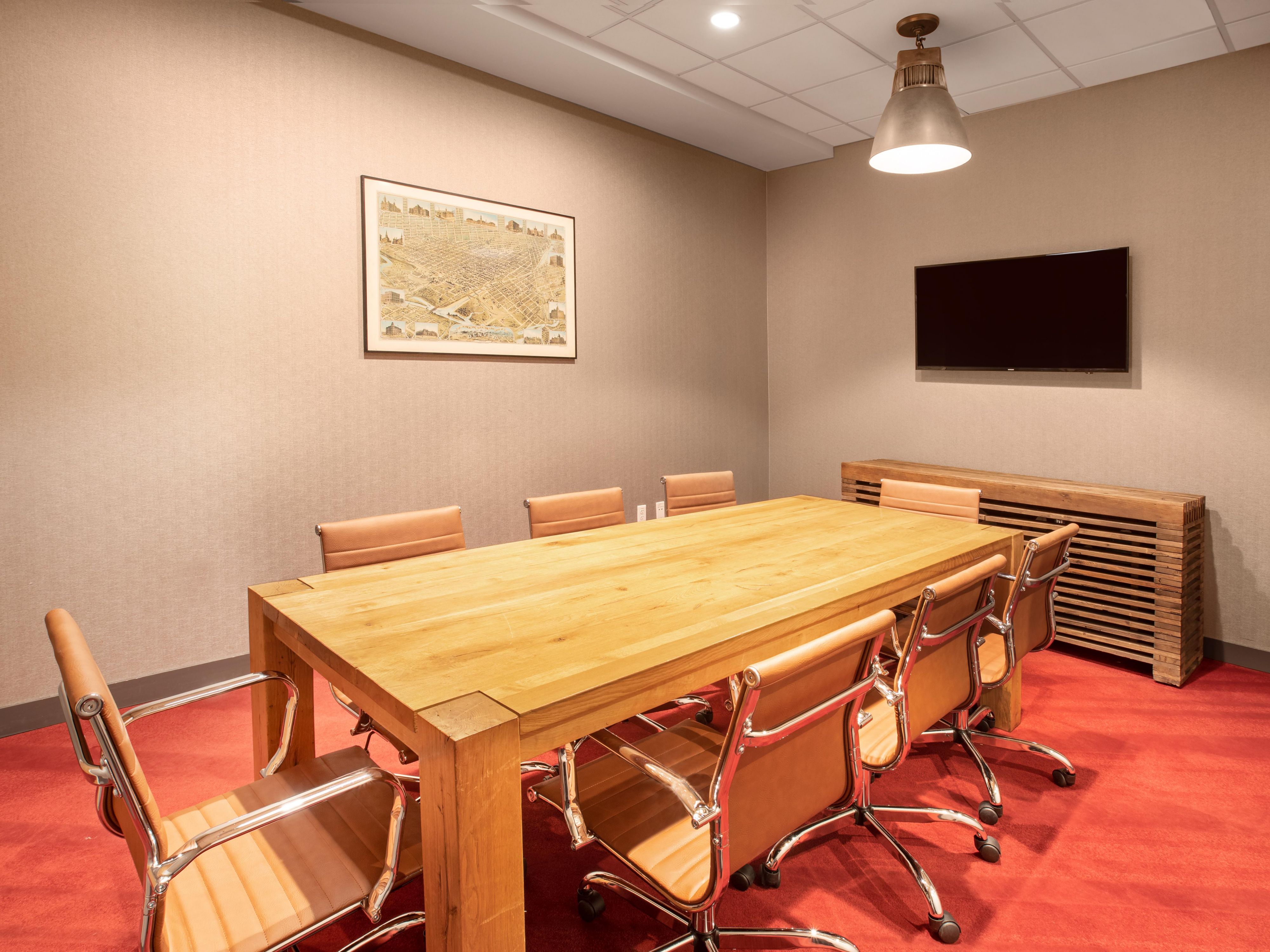 Boardroom with flat screen and comfortable seating up to 8