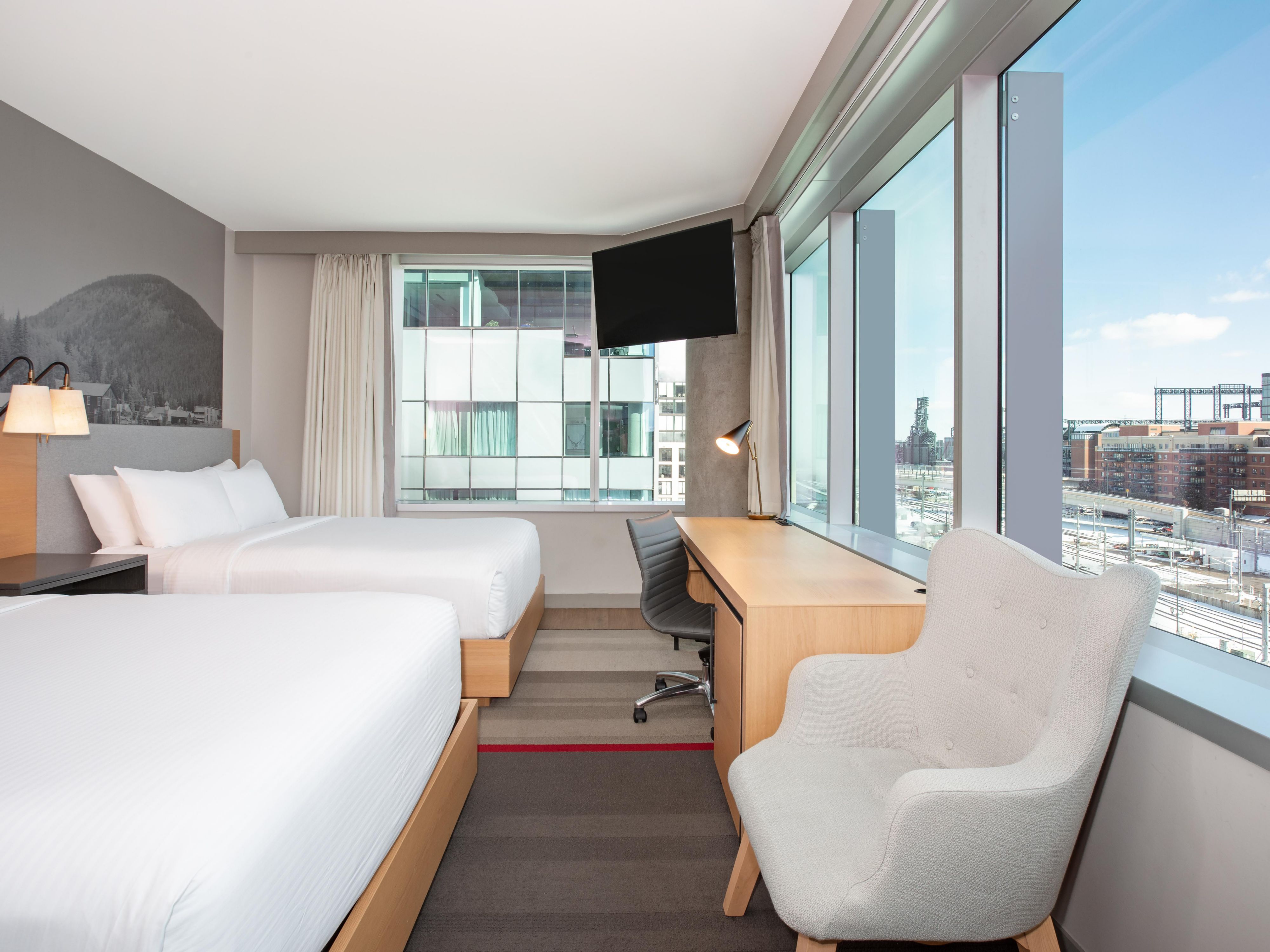 Two queen beds with downtown views