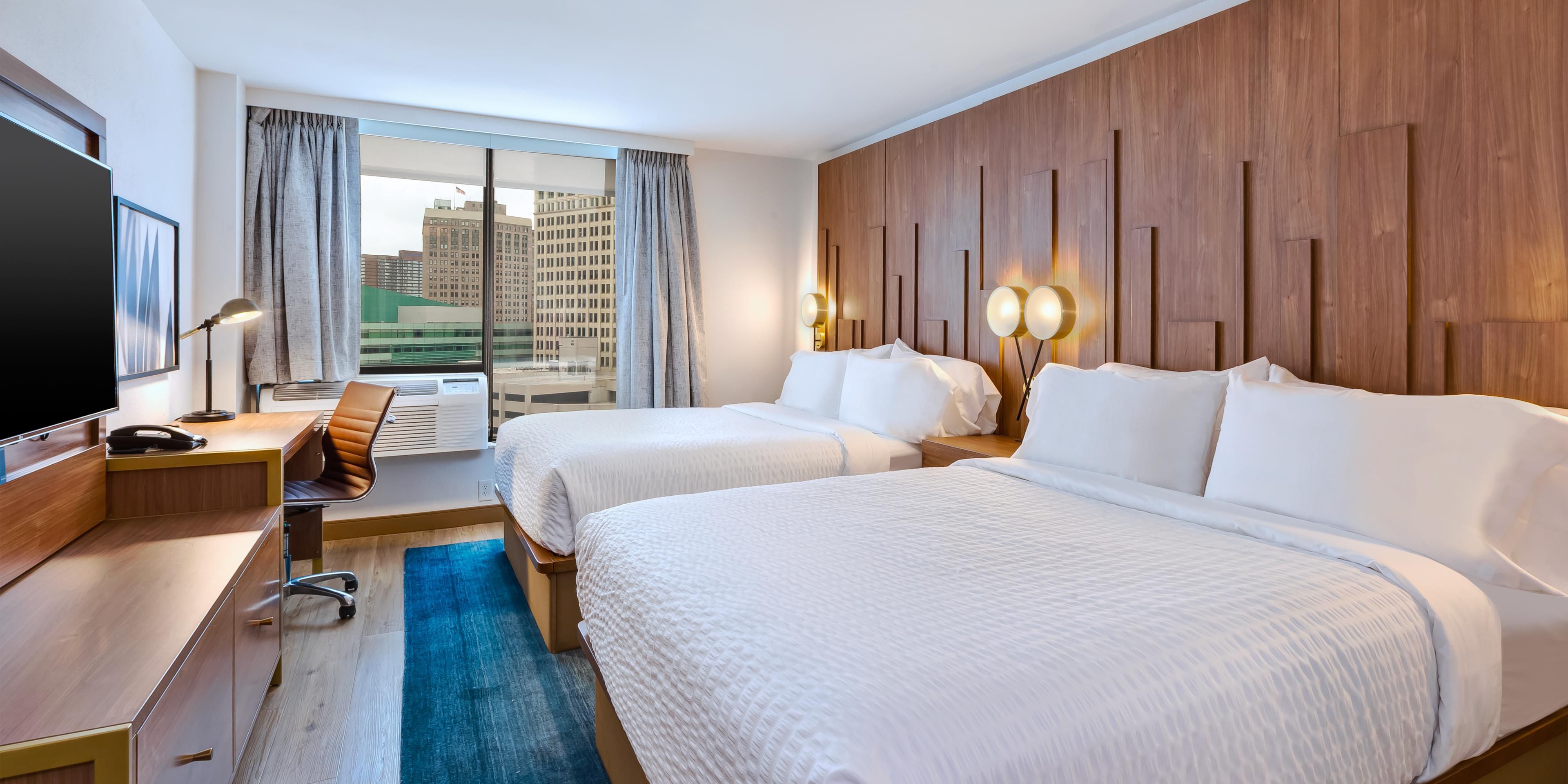Have company? We've got you covered in our 2 Queen Bed Guest Room.