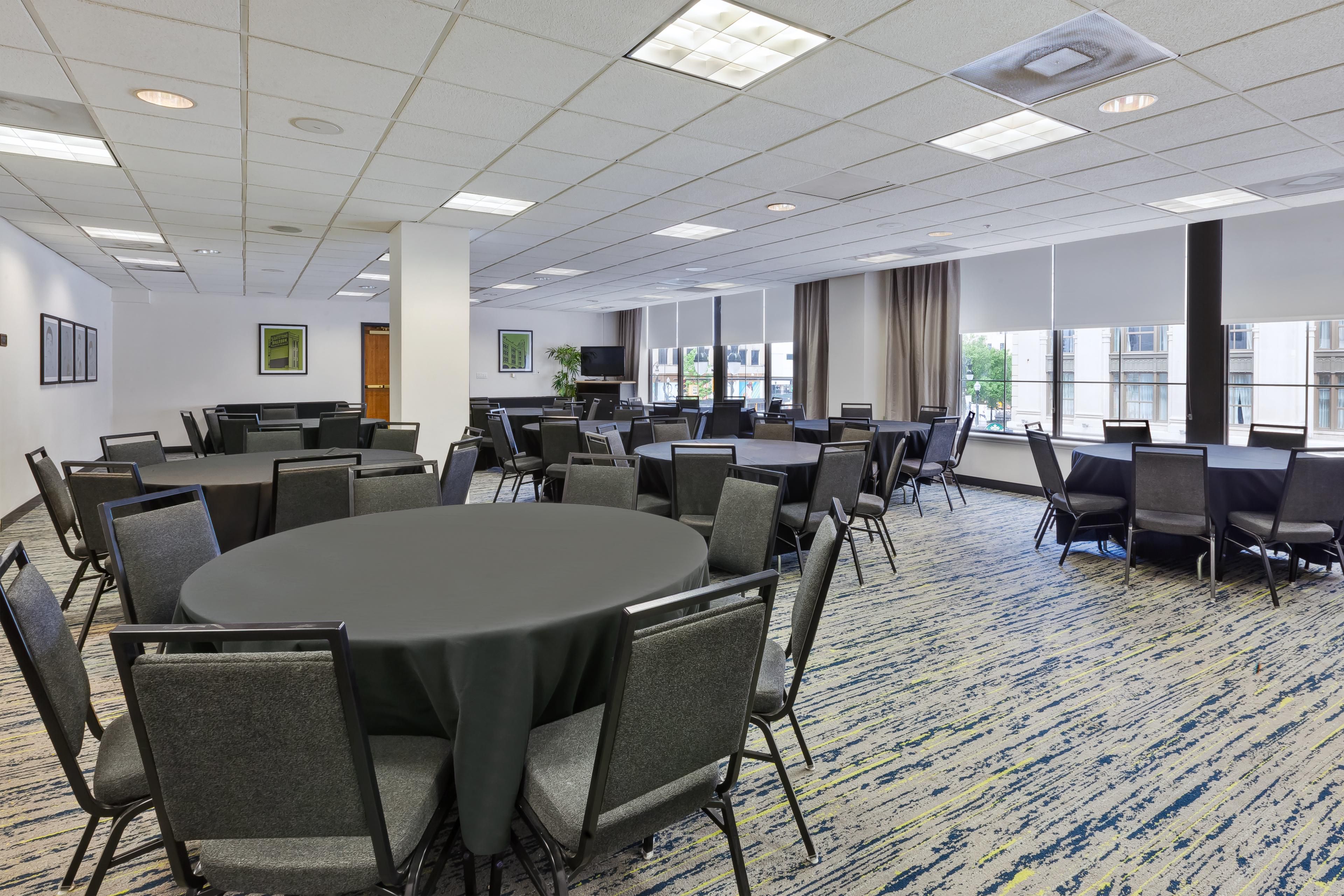 Meeting space with round tables set up