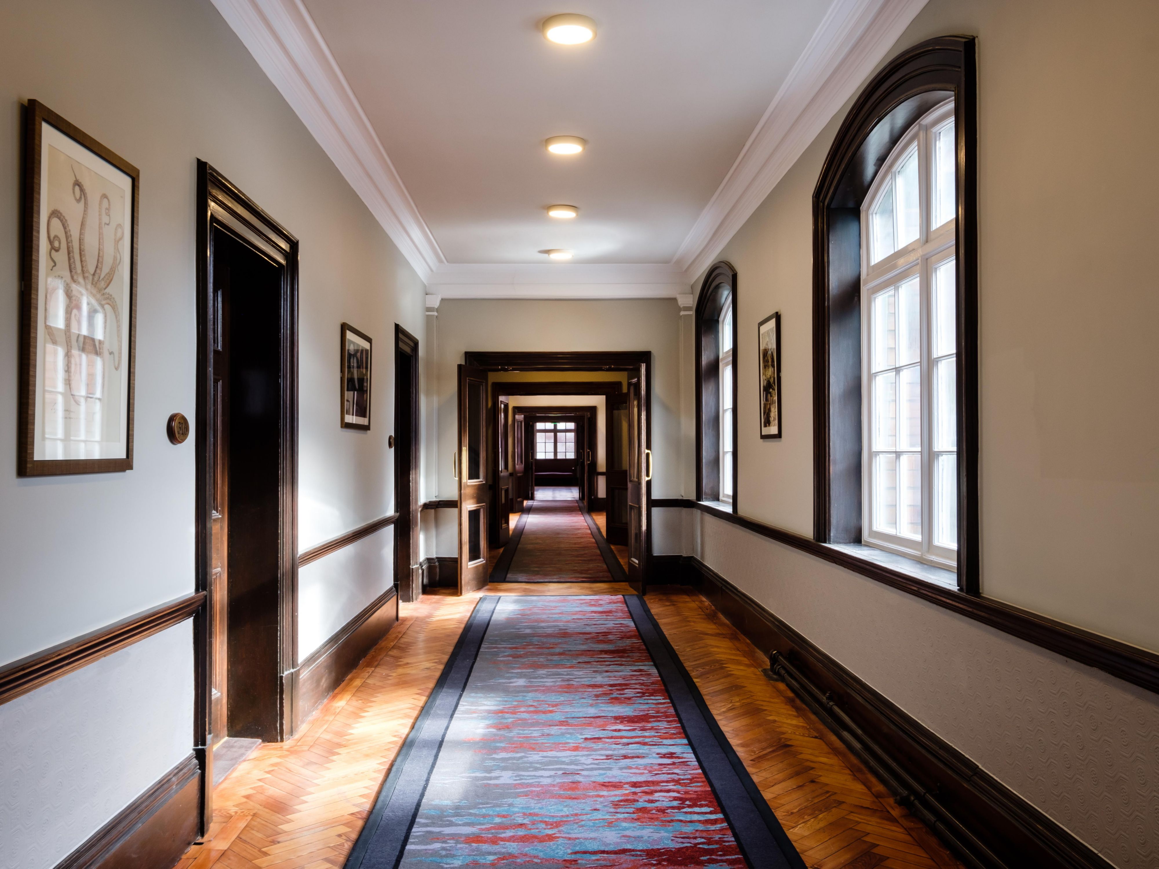 Orginal parquet flooring and stained glass lights our hallways  