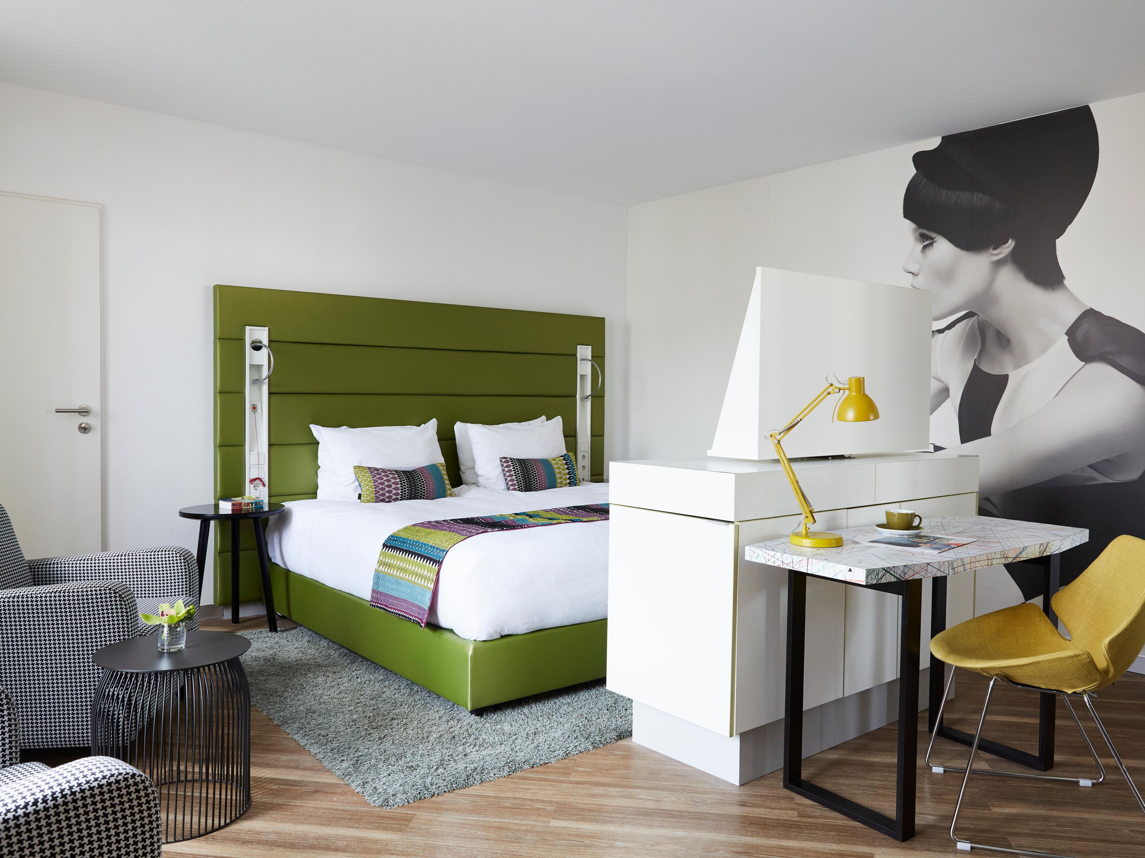 A fully accessible guest room in fresh, natural tones.