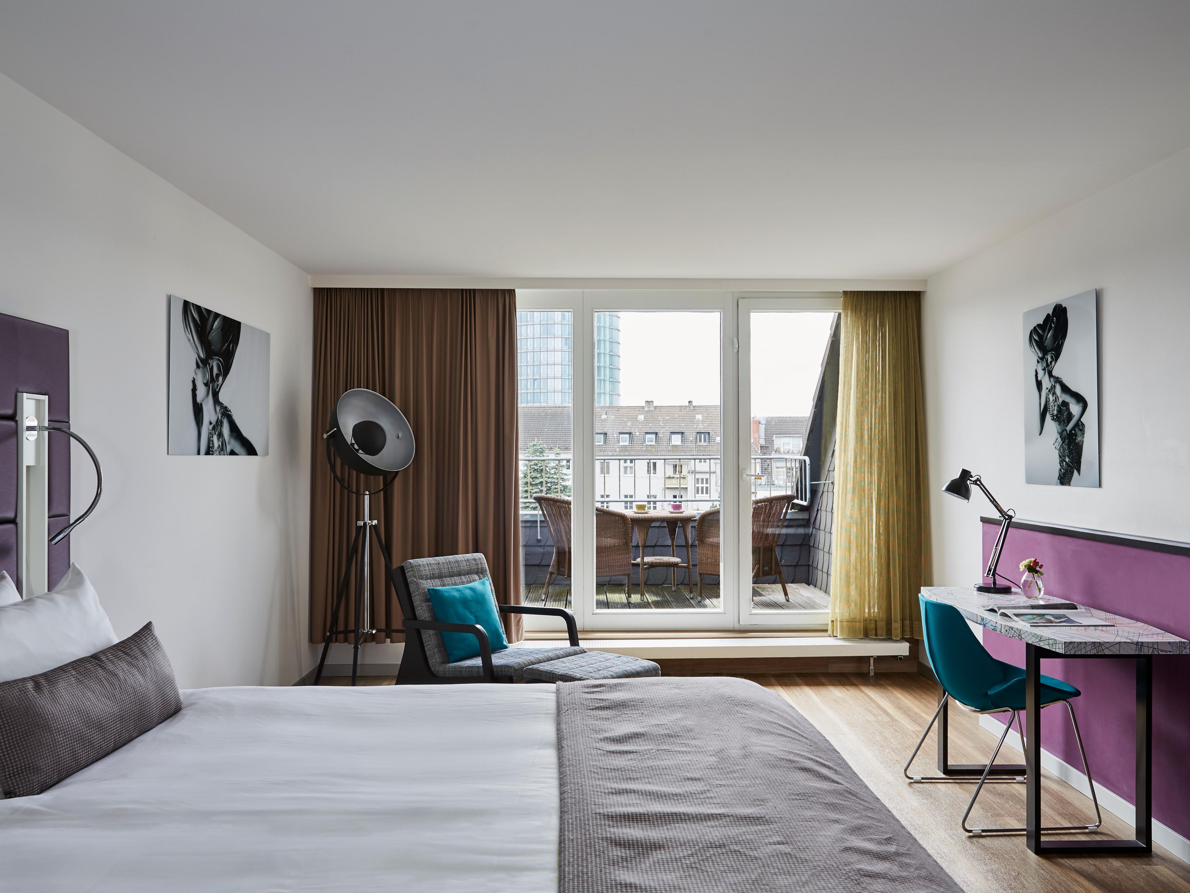 A balcony with seating in a spacious King Superior room.