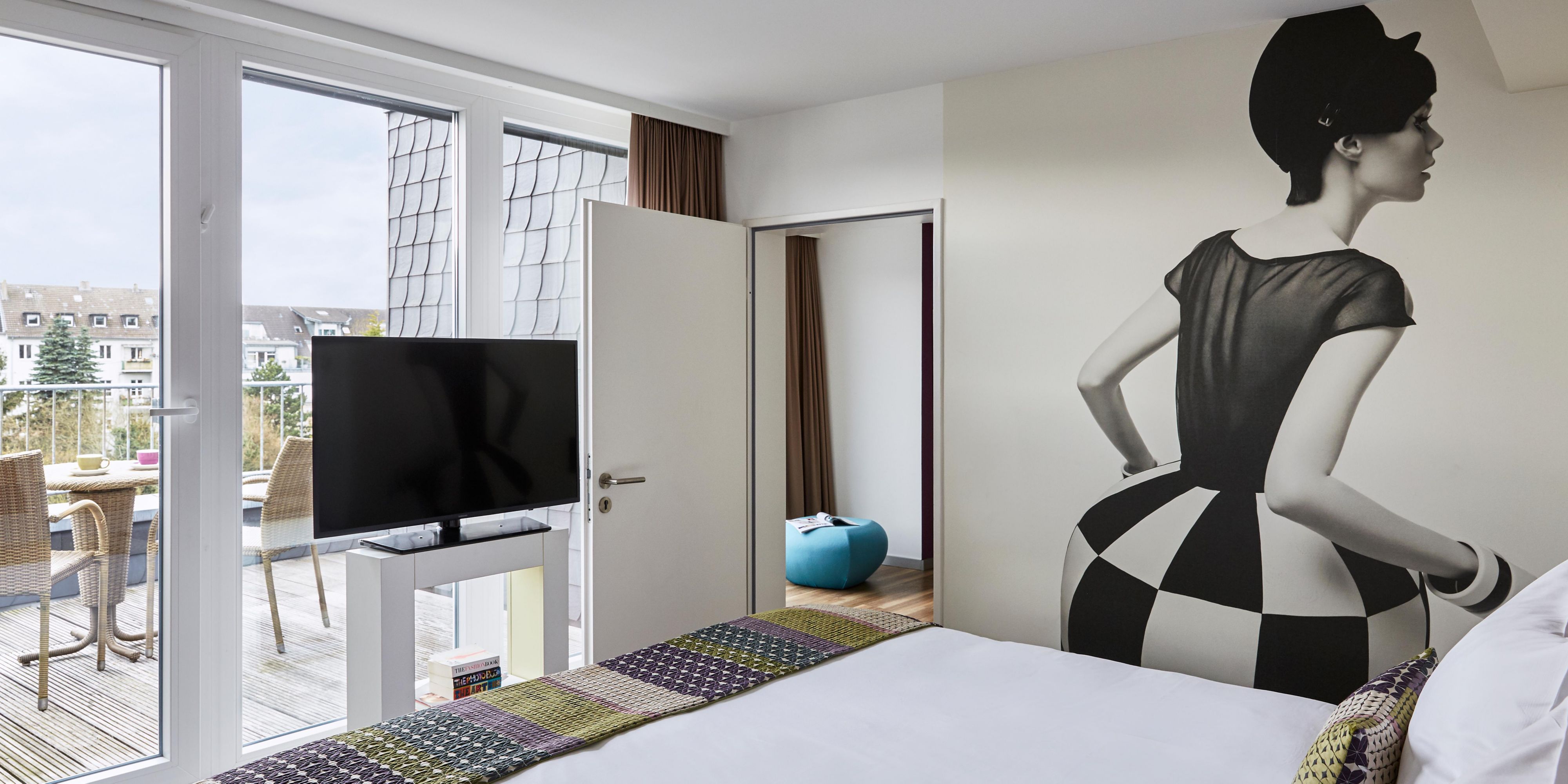 A spacious suite, with a roof terrace offering views of the city. 