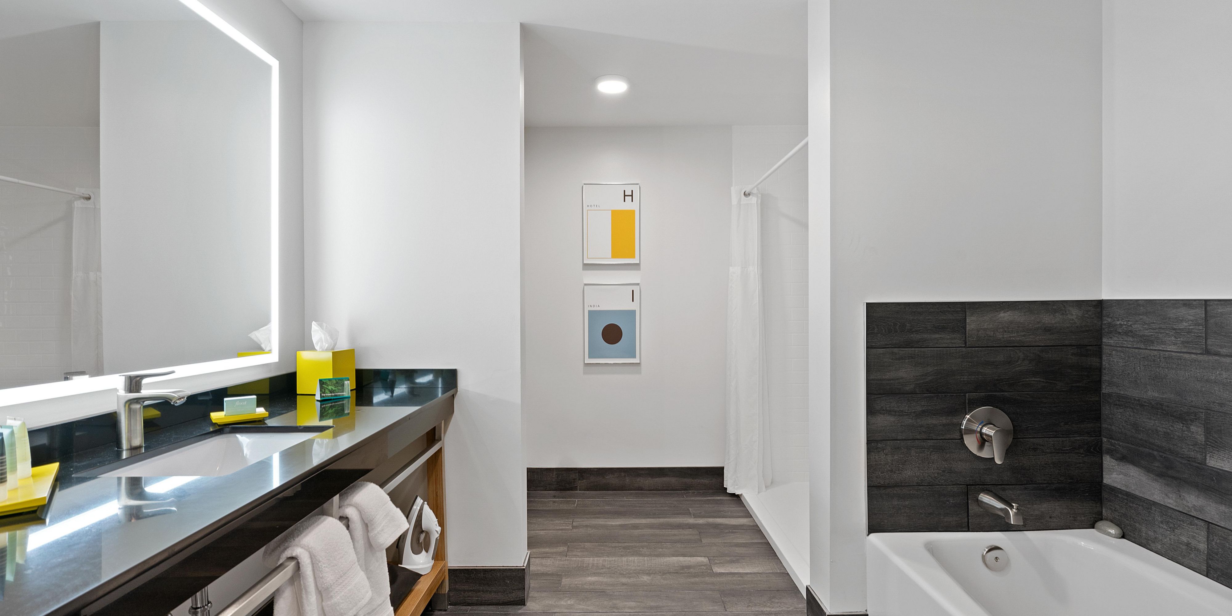 Spacious suite bathroom with standing shower and bathtub