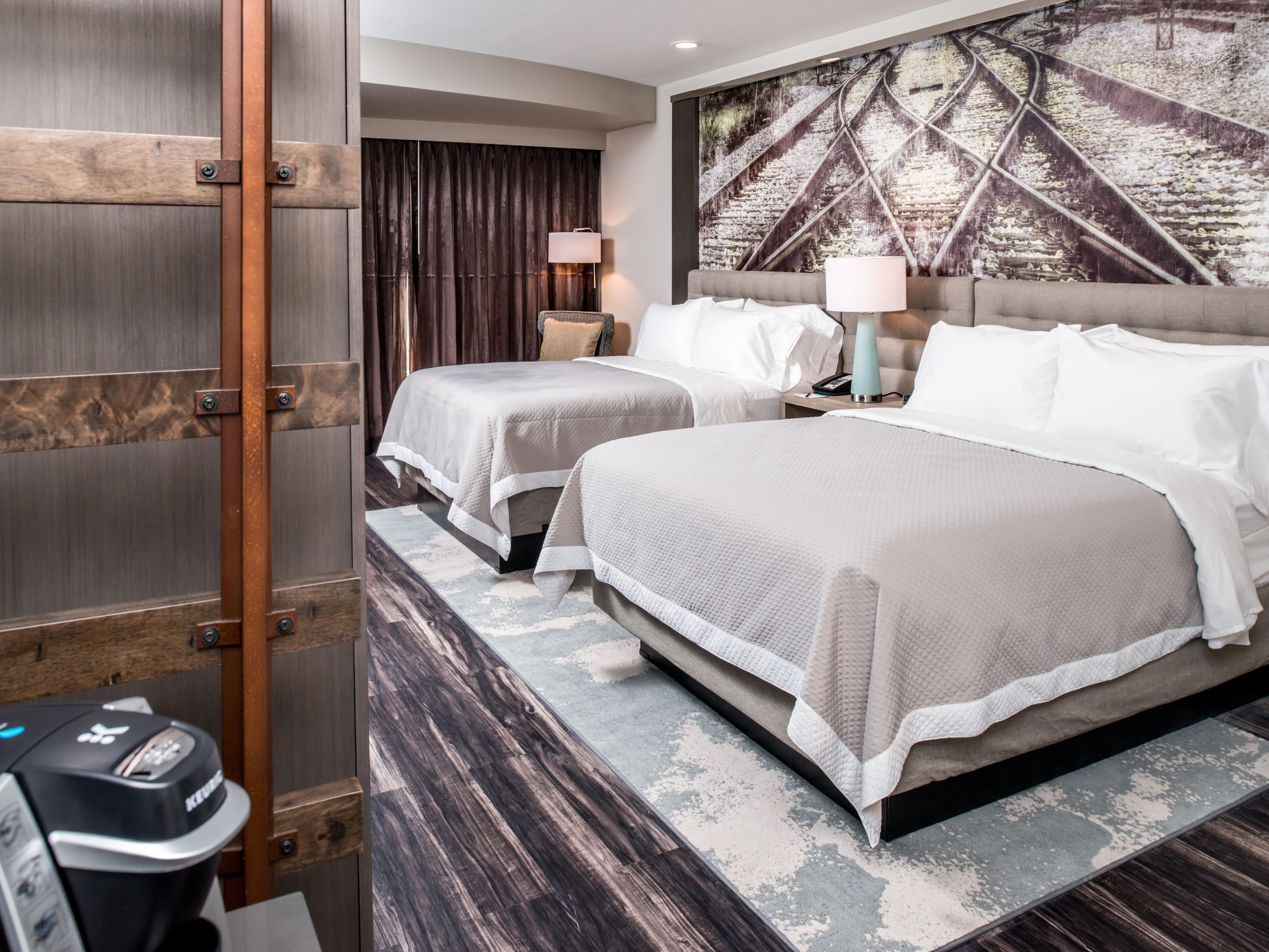 A room for everyone—two queen beds and thoughtful amenities.