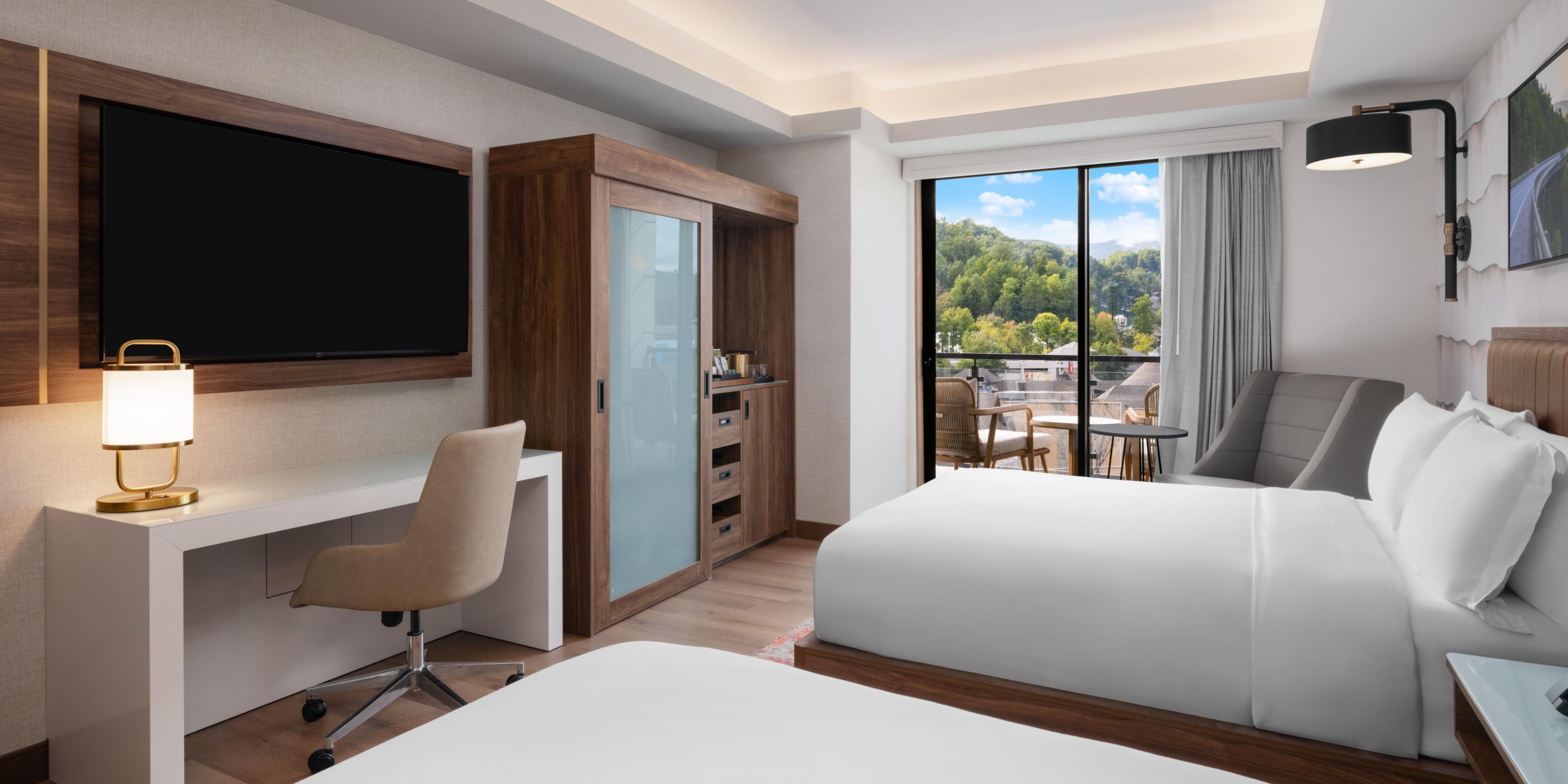 Spacious two queen room with private furnished balcony