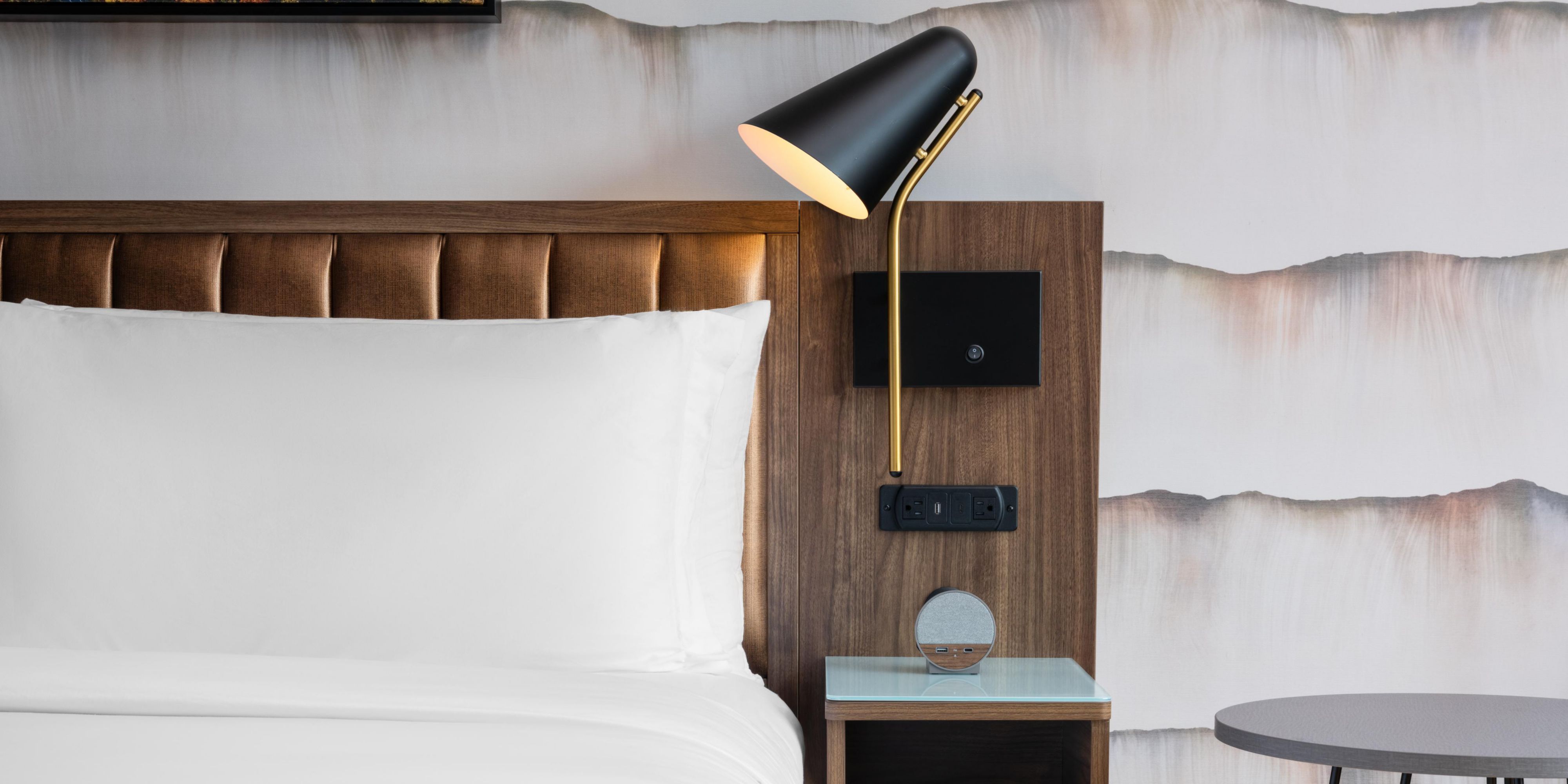 Plush bedding and warm bedside lighting