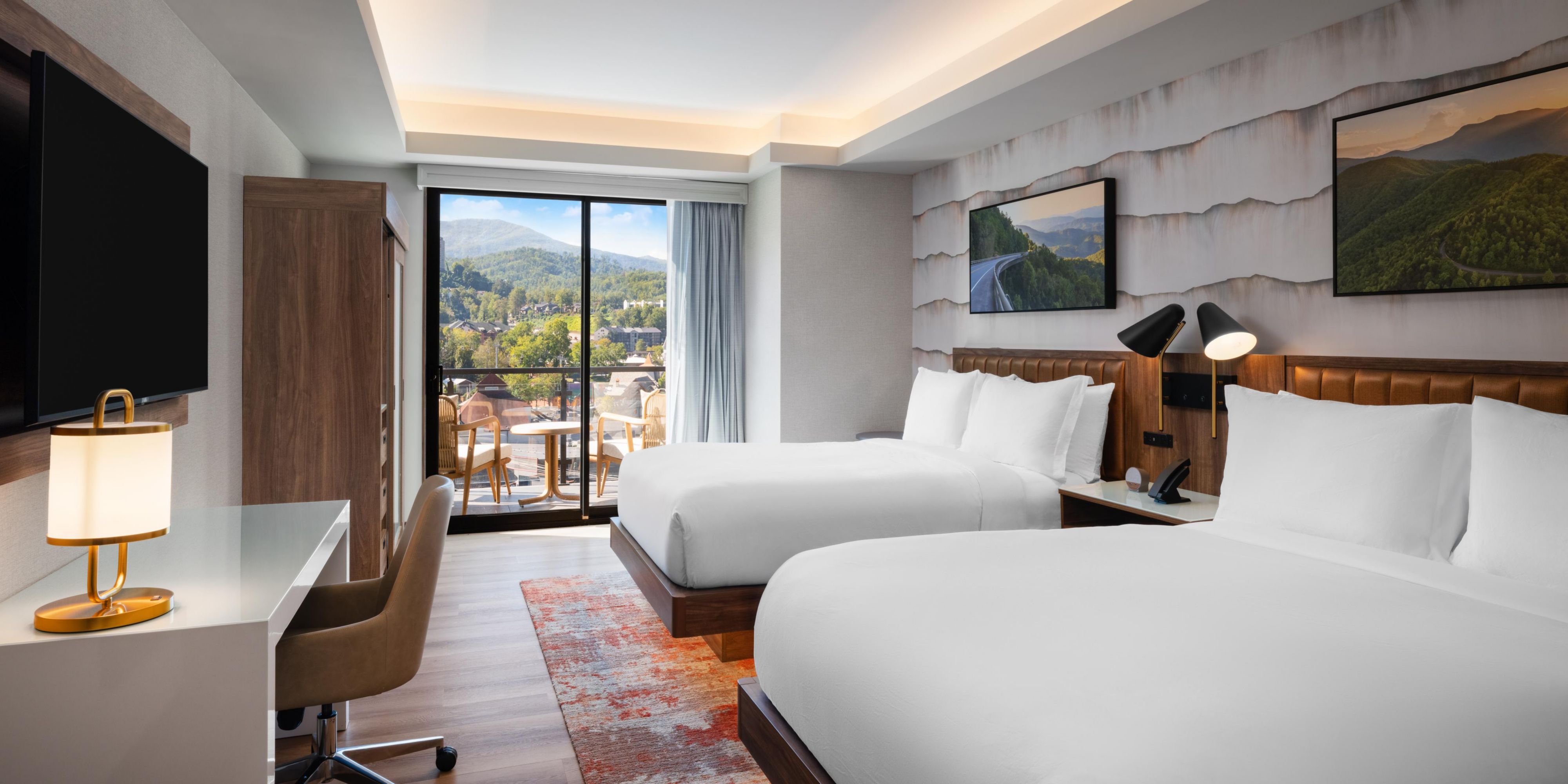 Relax outdoors in our two queen balcony guestroom