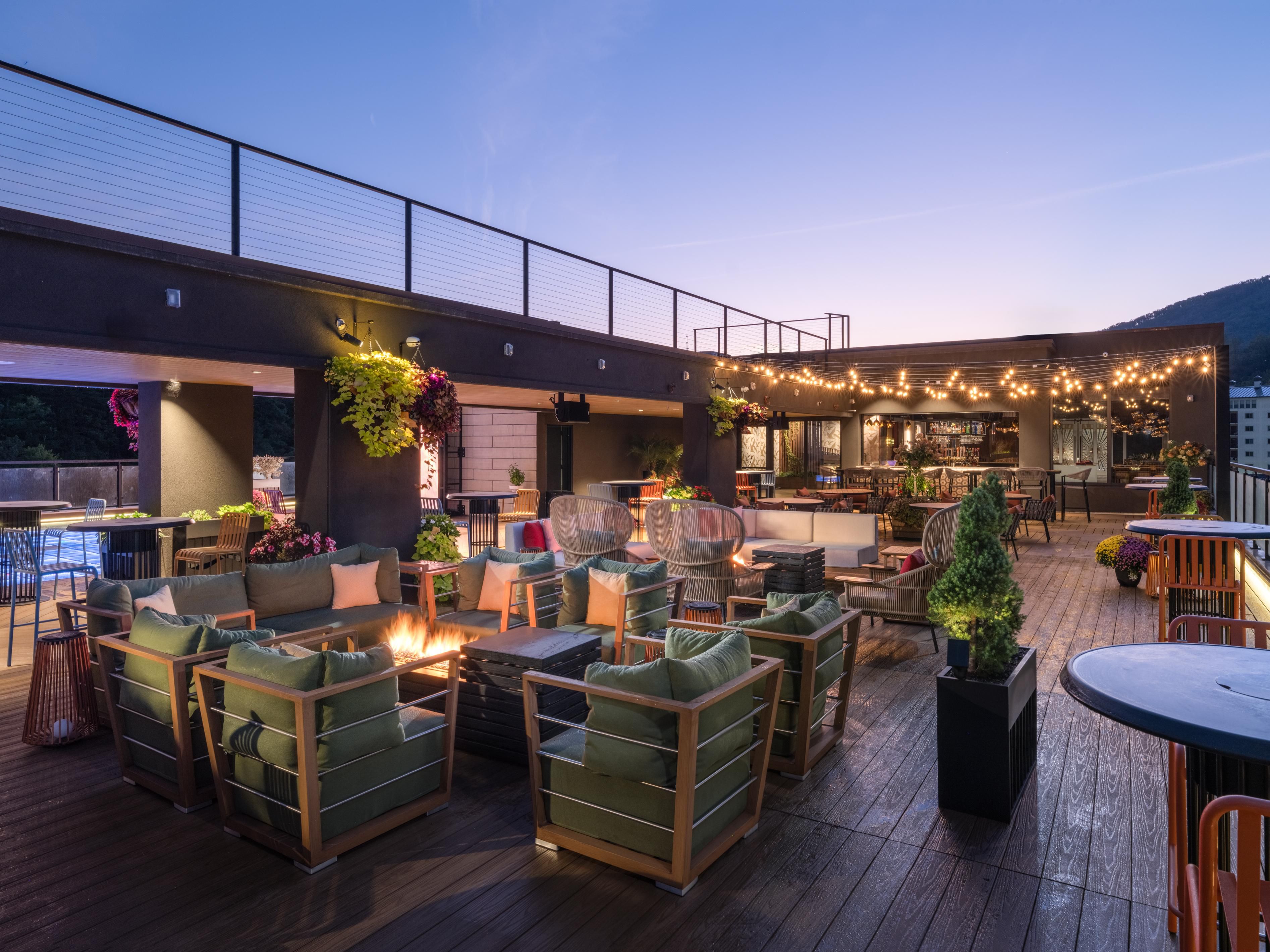 Rooftop patio with seating.