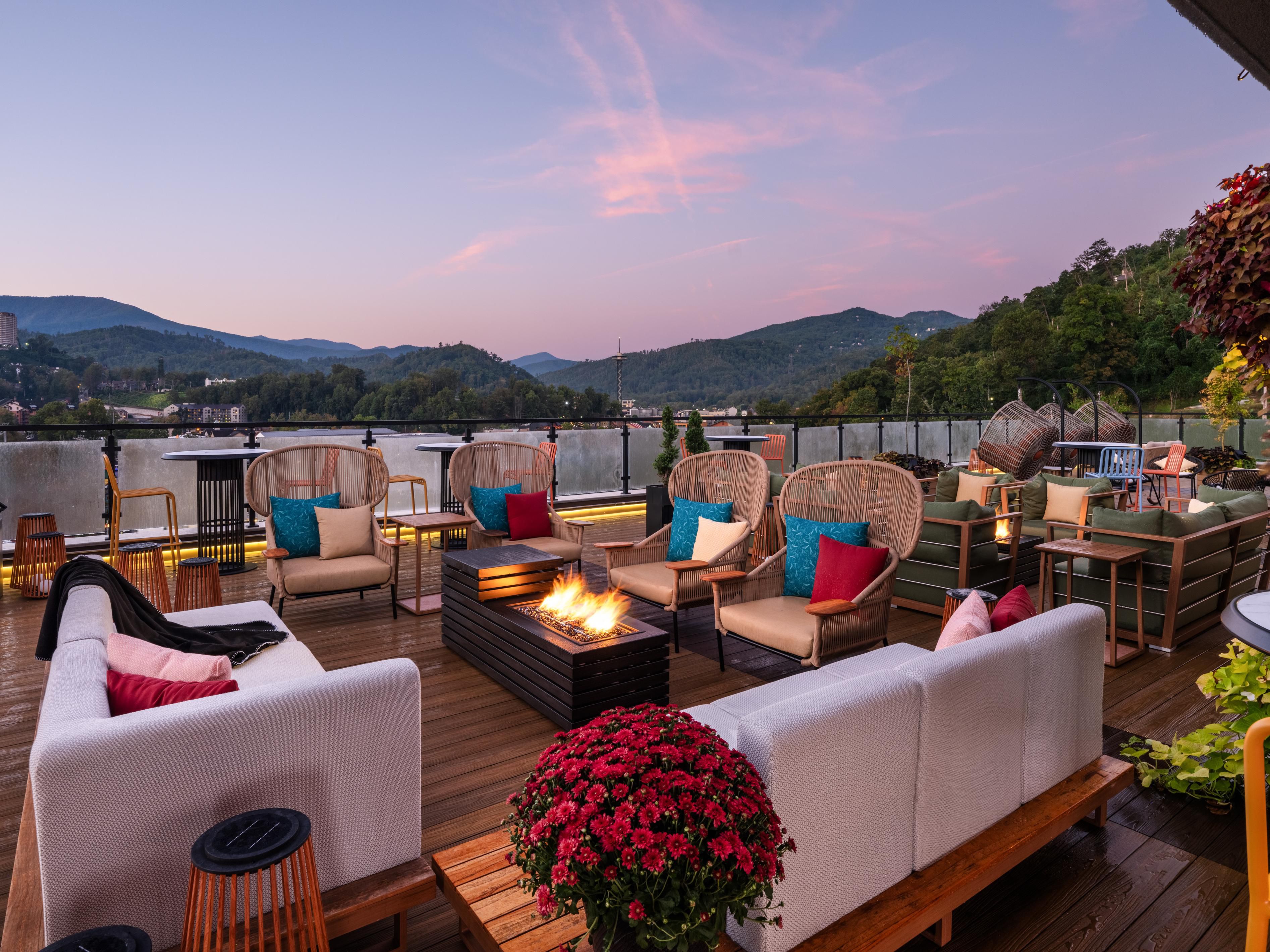 Rooftop sunsets warmed by the glow of the fire 