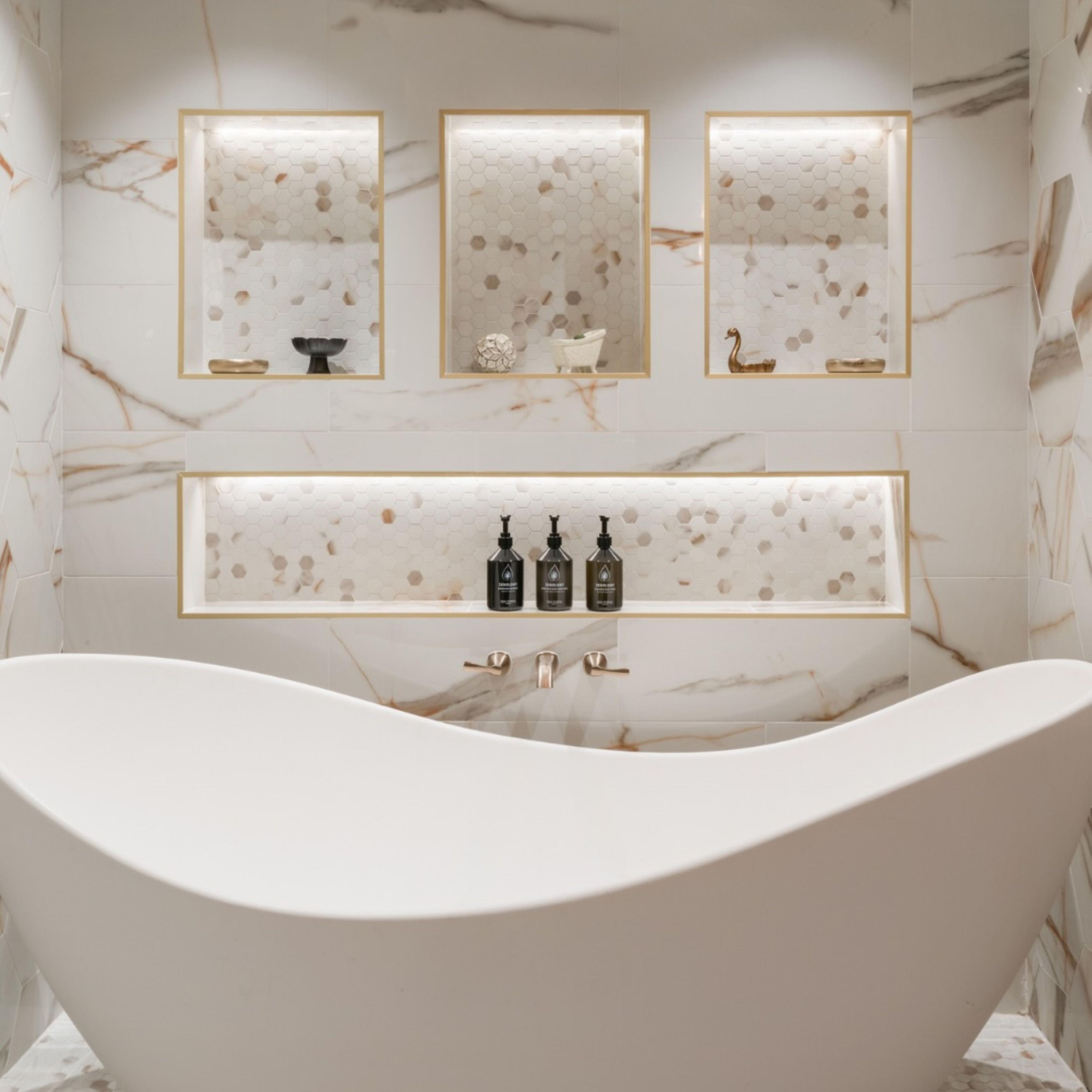 Modern hotel bathroom with a soaking tub and marble walls