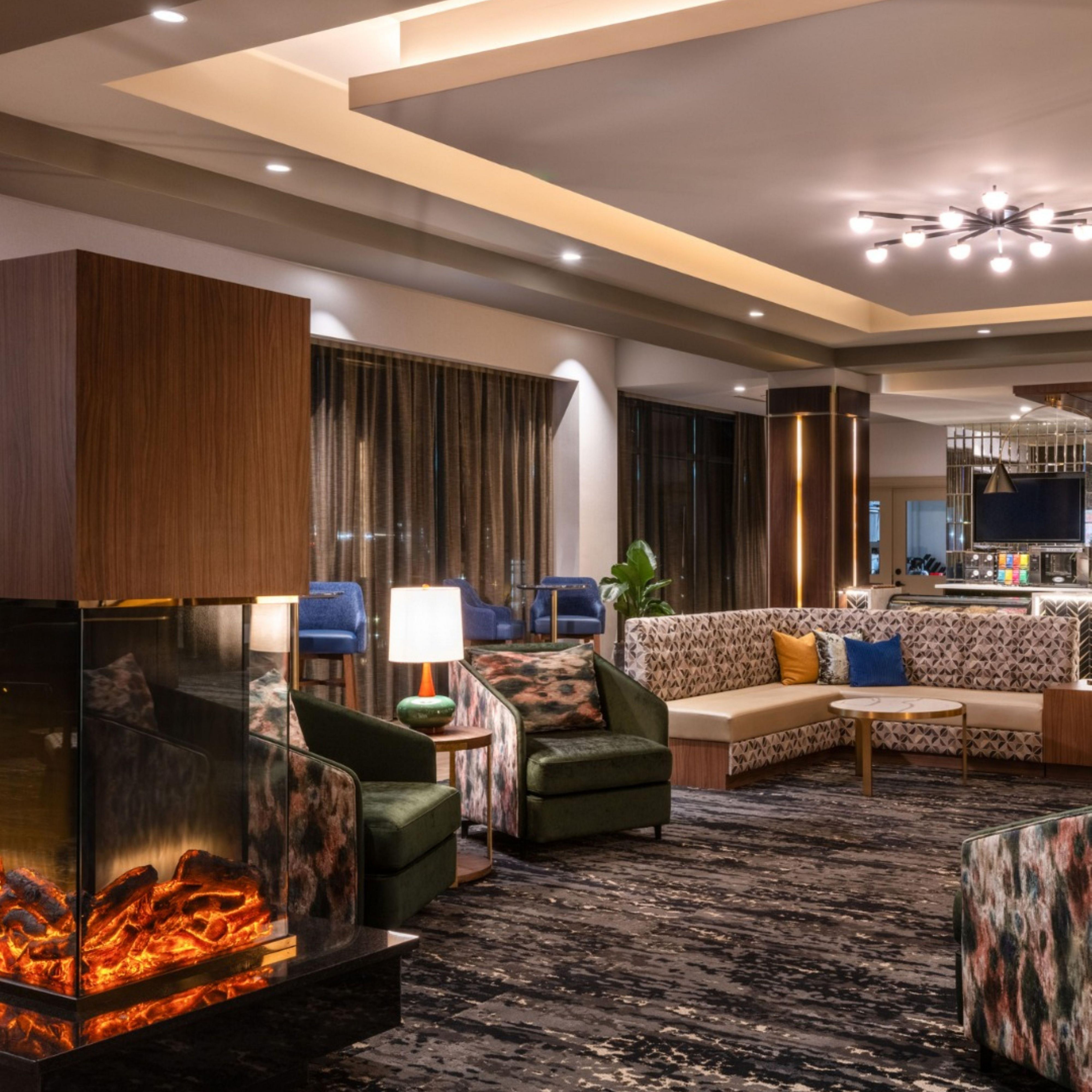 Inviting hotel lobby with cozy seating and a fireplace