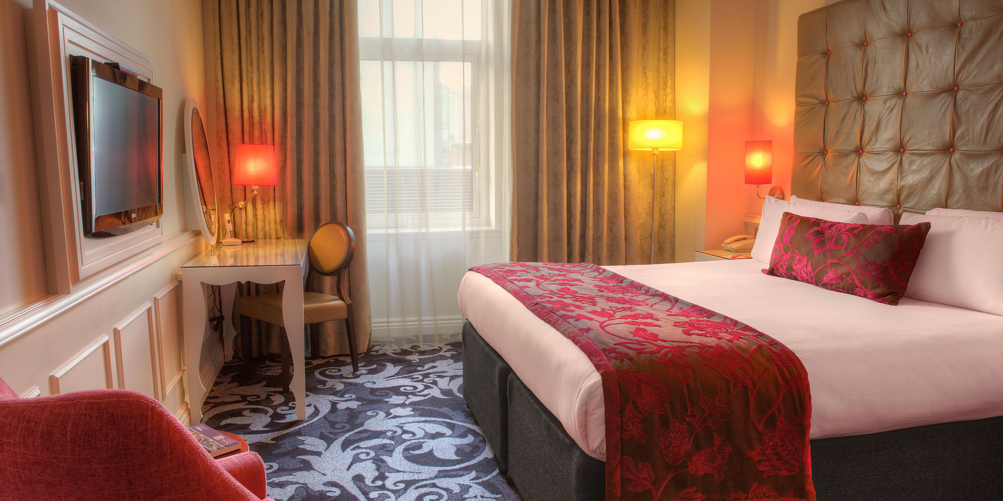 Enjoy luxurious beds, free WiFi and soft drinks from the mini bar