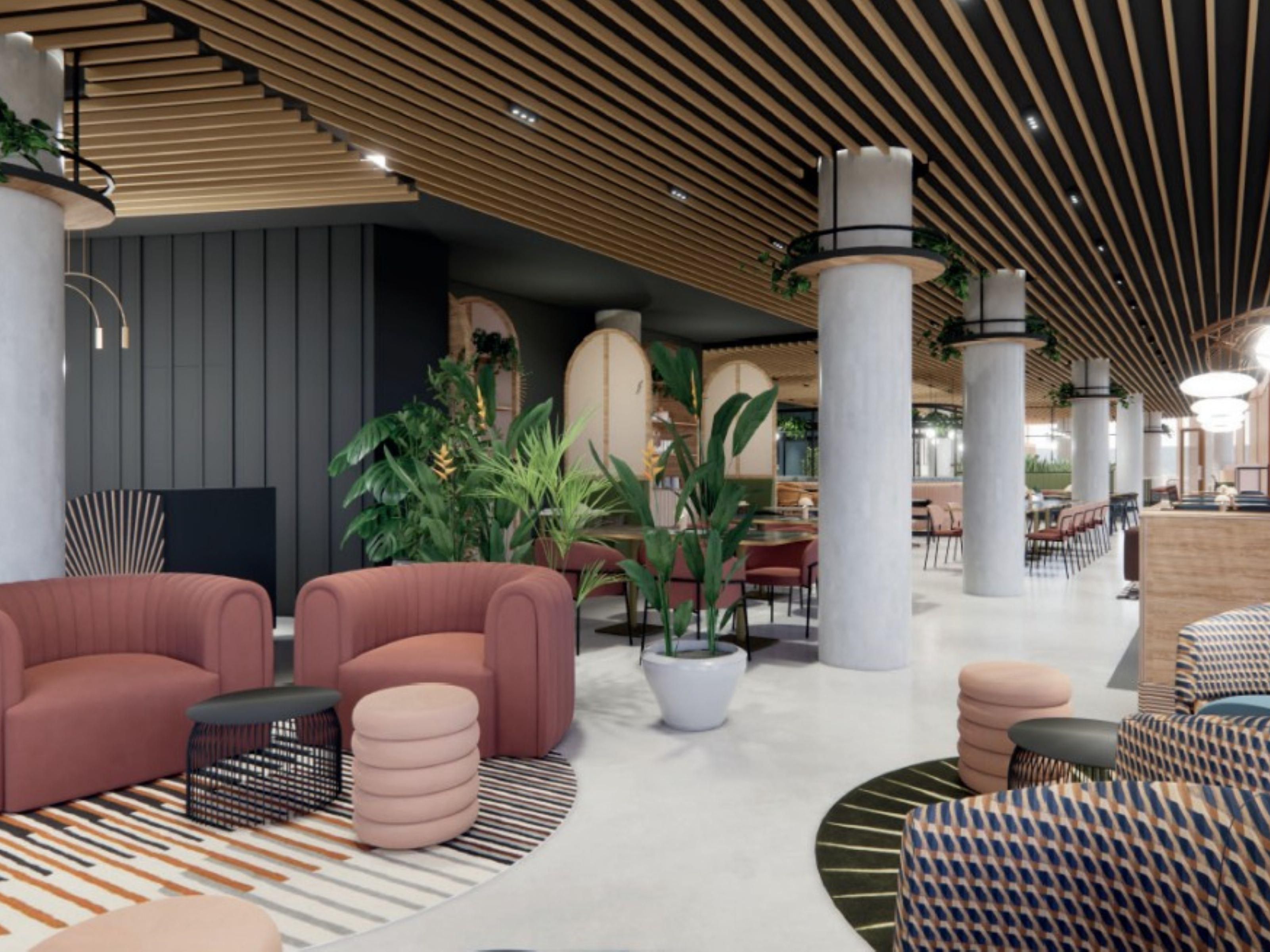 Lobby area with various seating and green plants