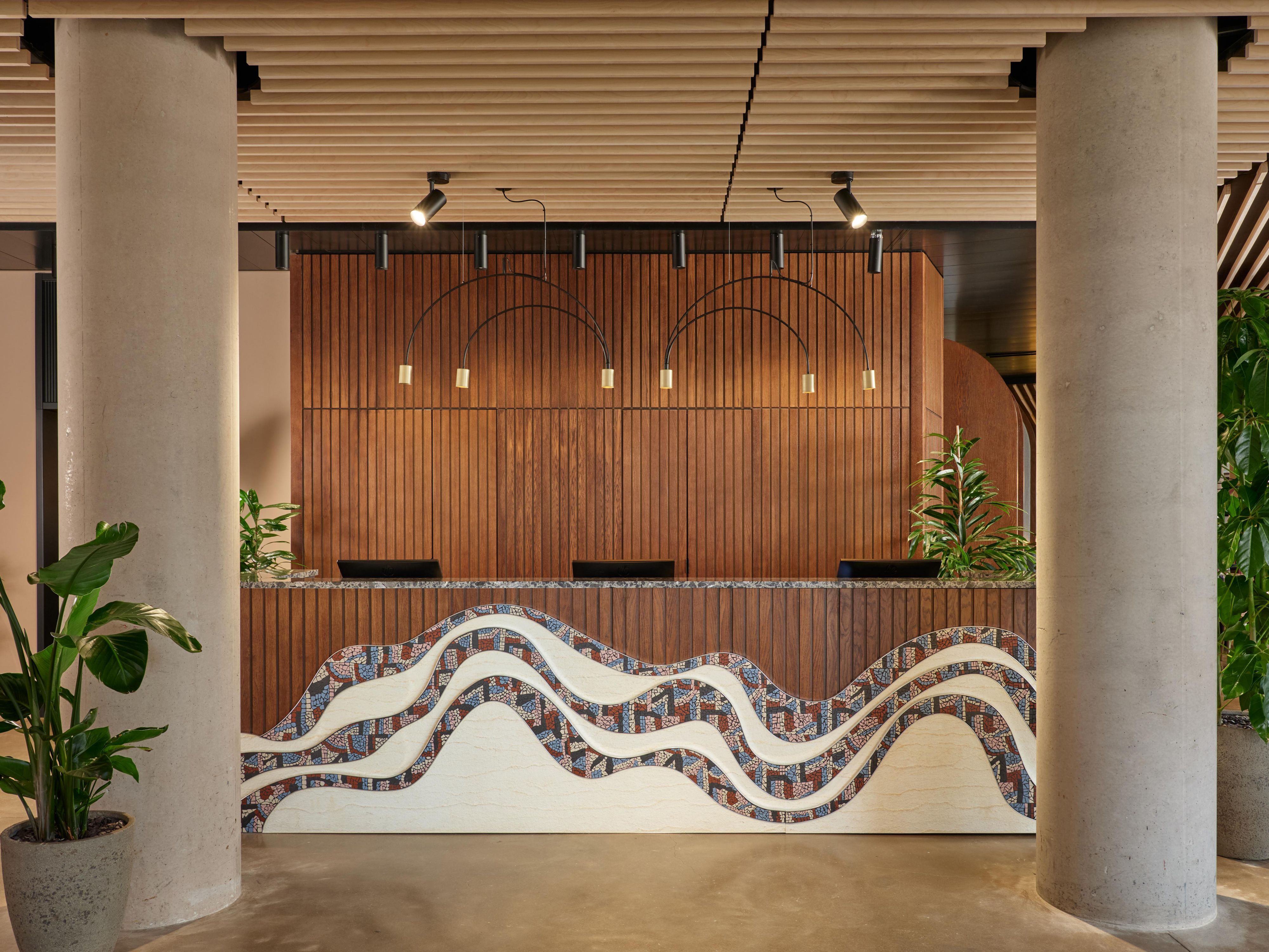 large hotel reception desk with wood panelling