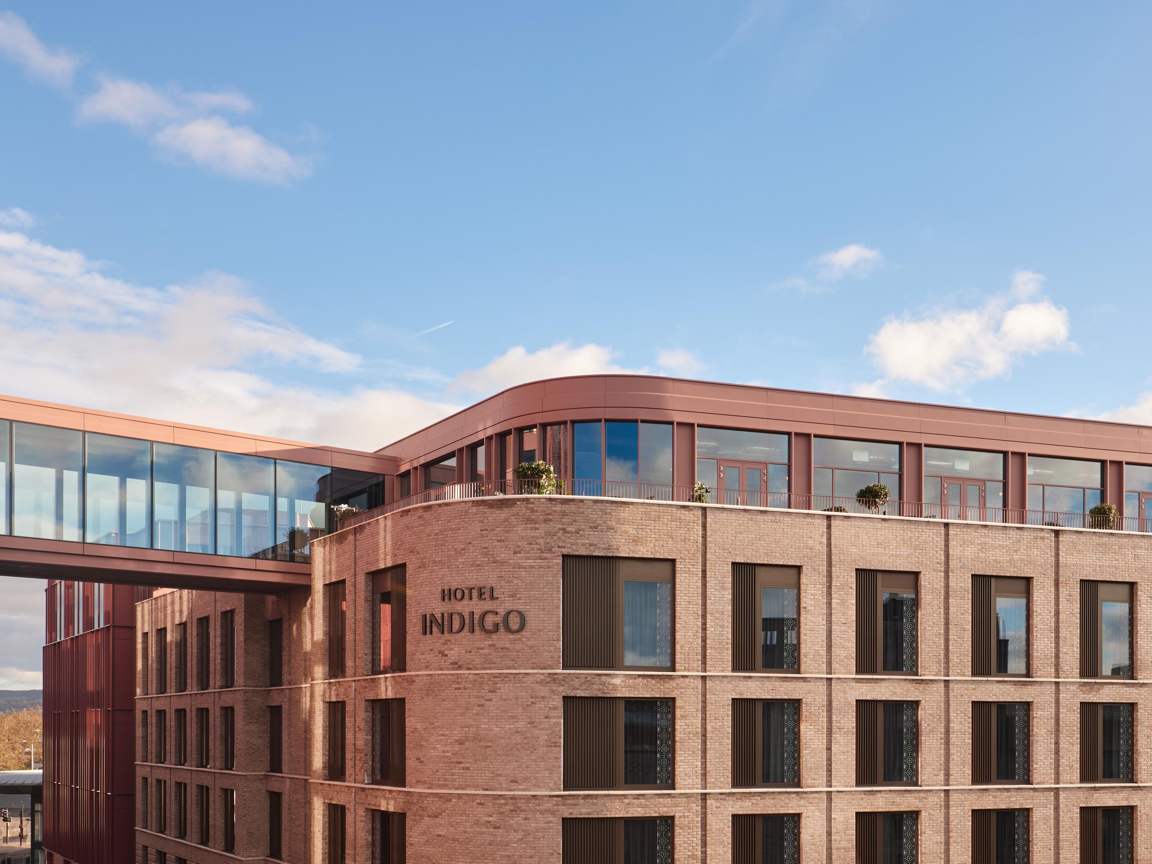 hotel exterior with hotel indigo sign on the building