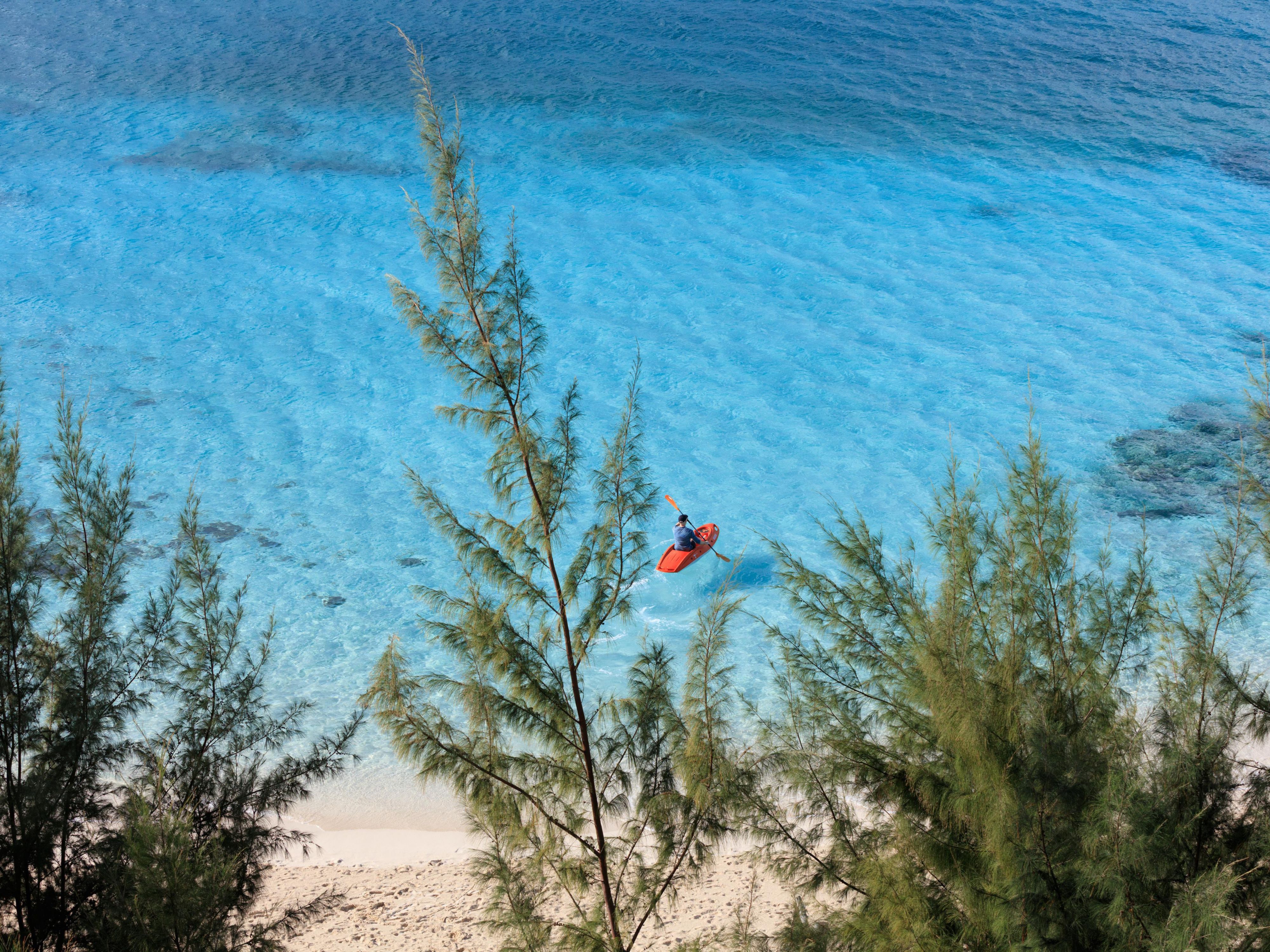 Kayak in turquoise waters off the coastline